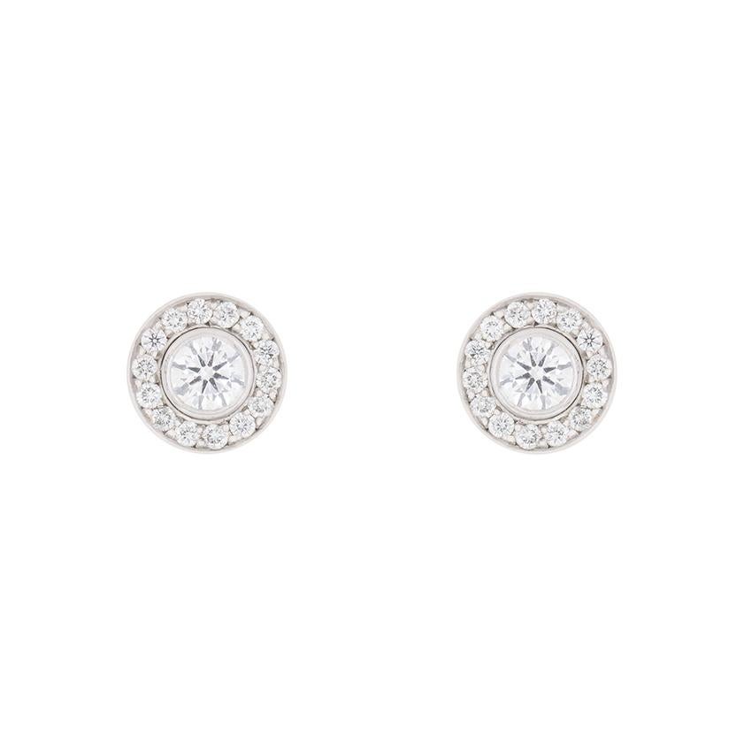 Garrard diamond drop earrings which also turn into stud earrings. Hallmarked in London in 2010, there are round brilliant cut diamonds at the centre of each earring. The halo surrounding is made up of 14 stones. The drop circle consists of 36