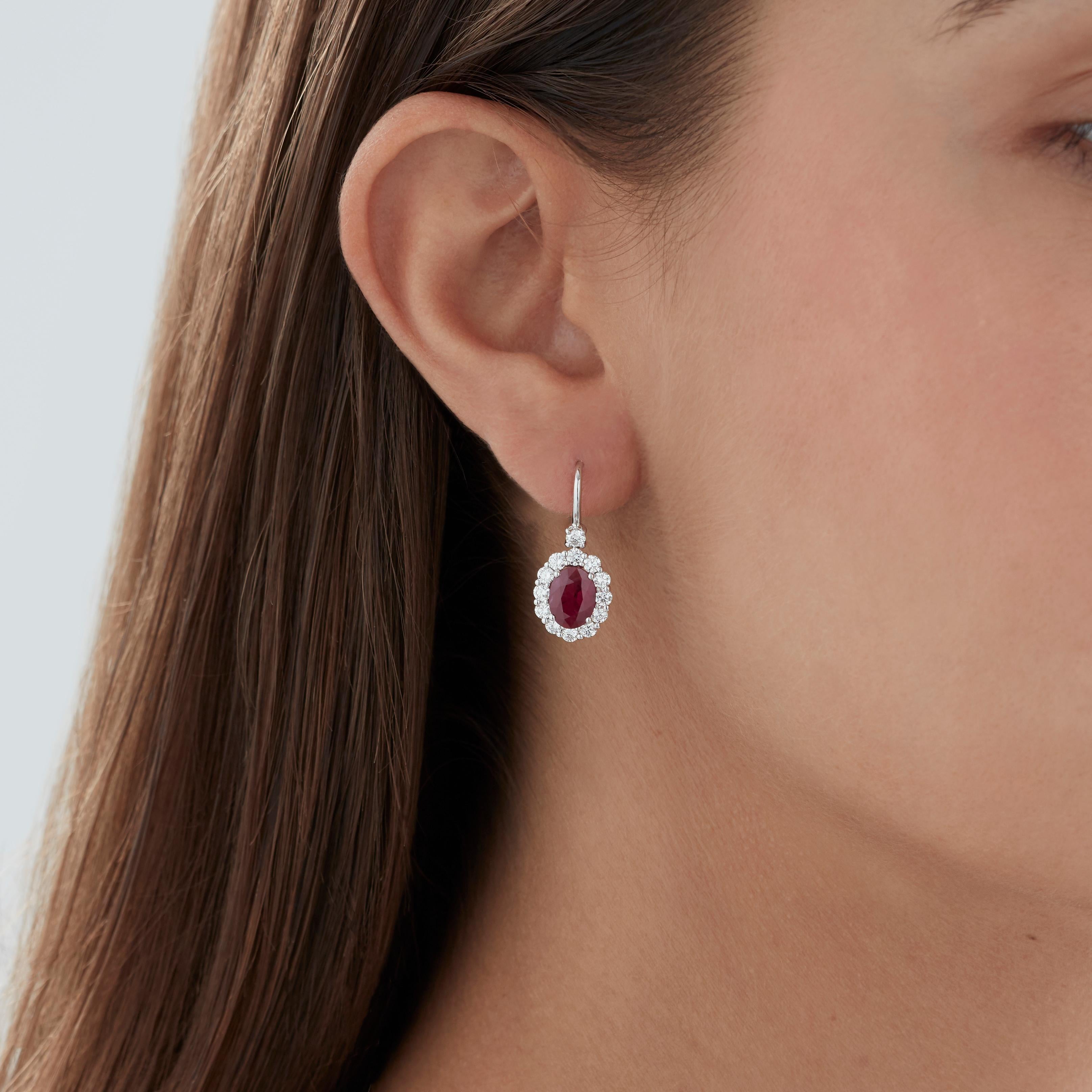 A House of Garrard pair of platinum drop earrings from the 'Garrard 1735' collection, set with central oval rubies and round white diamonds.

26 round white diamonds weighing: 1.12cts
2 oval rubies approx 8x6mm

The House of Garrard is the longest