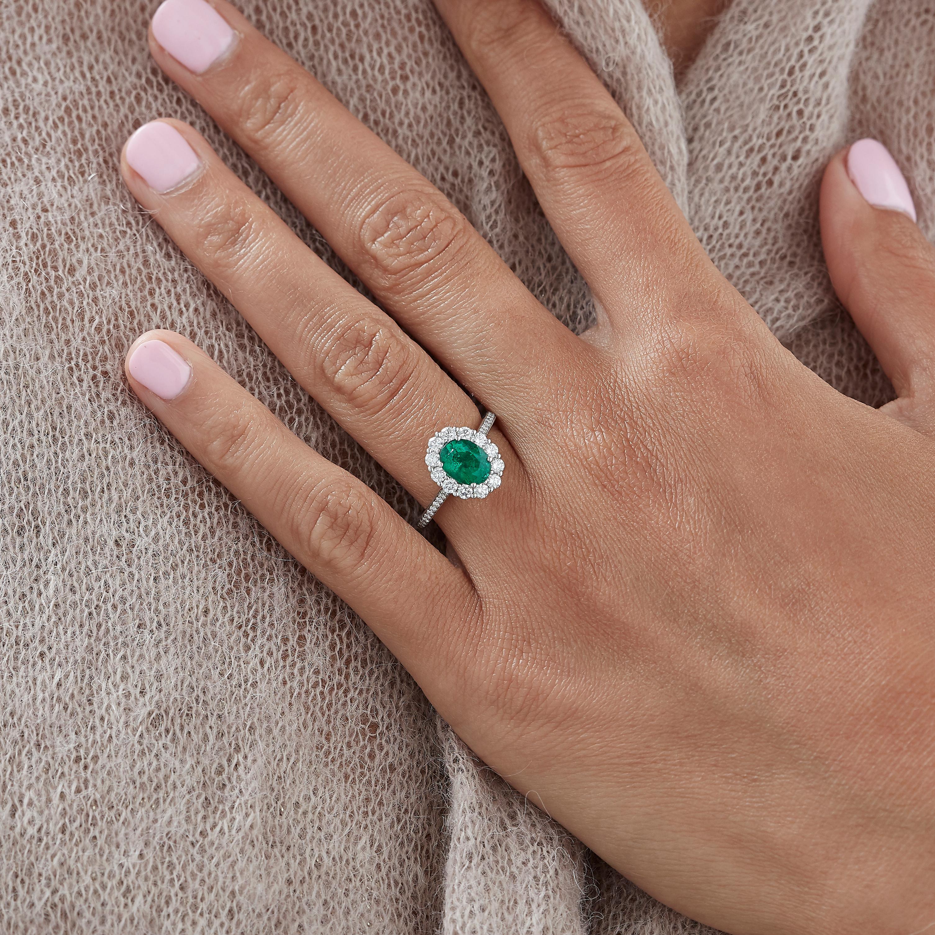 A House of Garrard platinum ring from the 'Garrard 1735' collection, set with a central oval emerald and round white diamonds.

1 oval emerald approx 1.35ct
30 round white diamonds weighing 0.60cts
Total diamond weight: 0.60cts   
Size: 51

Please