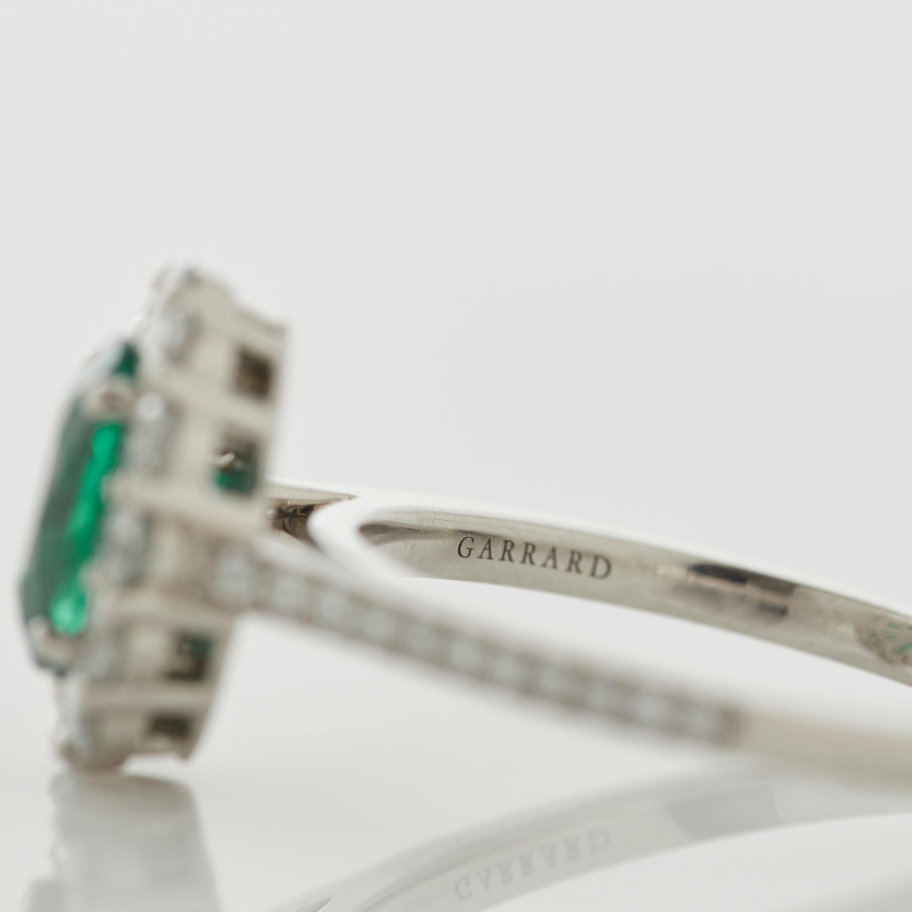 Oval Cut Garrard '1735' Platinum Oval Emerald and White Diamond Cluster Ring