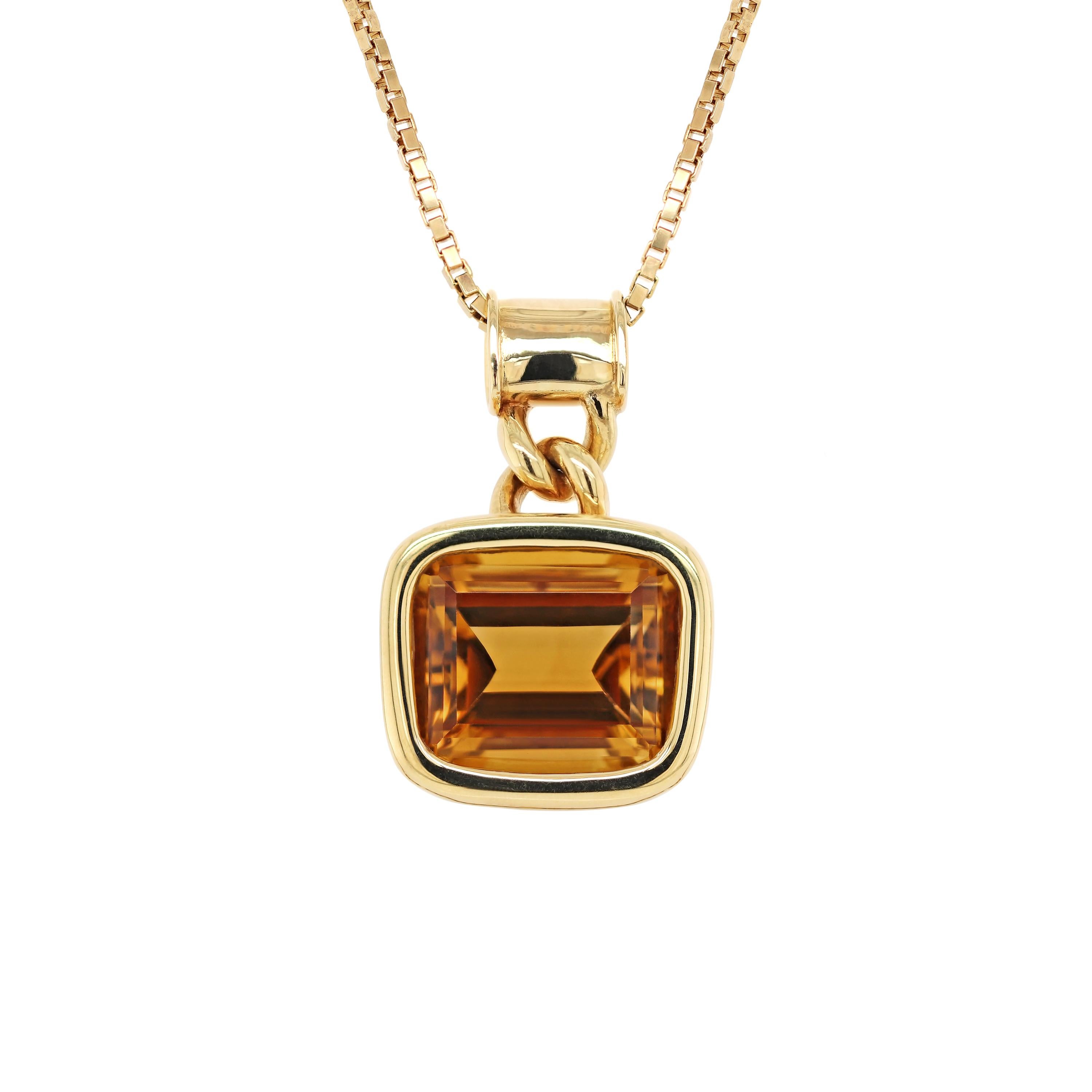 This impressive citrine set was designed by The House of Garrard, the longest serving jeweller in the world. 
The pendant features a beautiful golden citrine weighing approximately 40.00 carats mounted in a rub-over, open back setting. The pendant