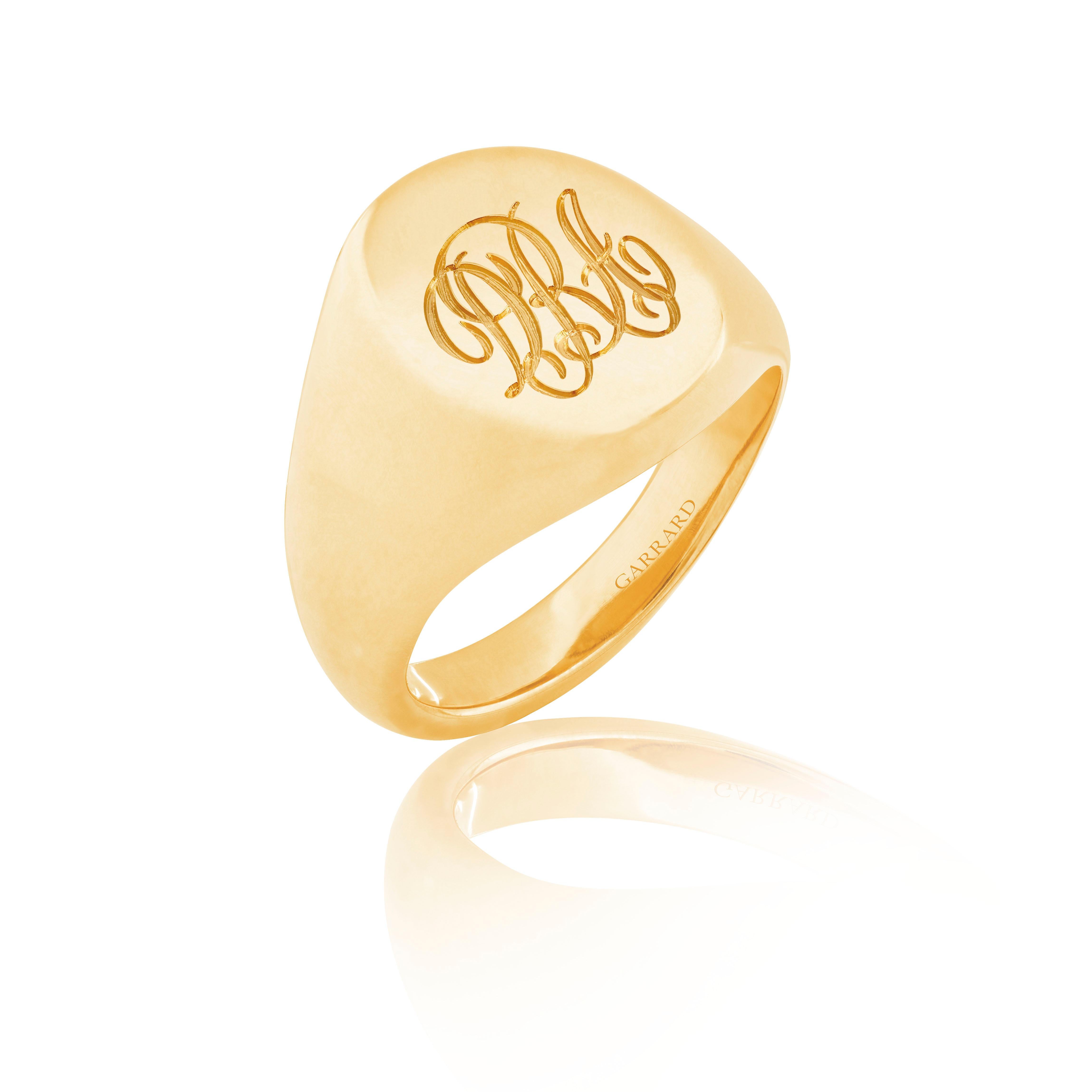 A House of Garrard 18 karat yellow gold large oval signet ring.

Head dimension: 16mm x 13mm
Size 54

Complimentary engraving of up to three initials in a script font is included. Please allow an additional two weeks to the standard shipping and