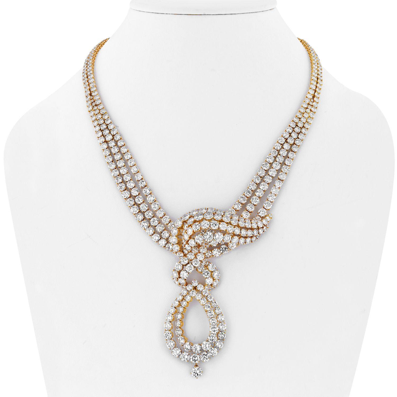 An exceptional elegance by M. Gerard presents itself in this stunning estate diamond necklace. 
This collar drop necklace is crafted in 18k yellow gold, mounted with 80 carats of round cut diamonds. Of stylised openwork design, the necklace set