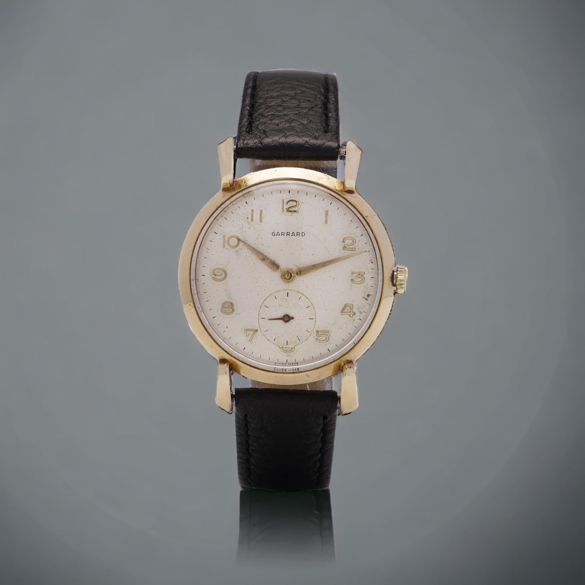 Vintage Garrard 9kt. gold men's wristwatch. 
There are hallmarks inside the case back for London, 1957 
The dial is signed with the original retailer’s name of Garrard.

Garrard & Co. is one of the world's most venerable jewellers and silversmiths.