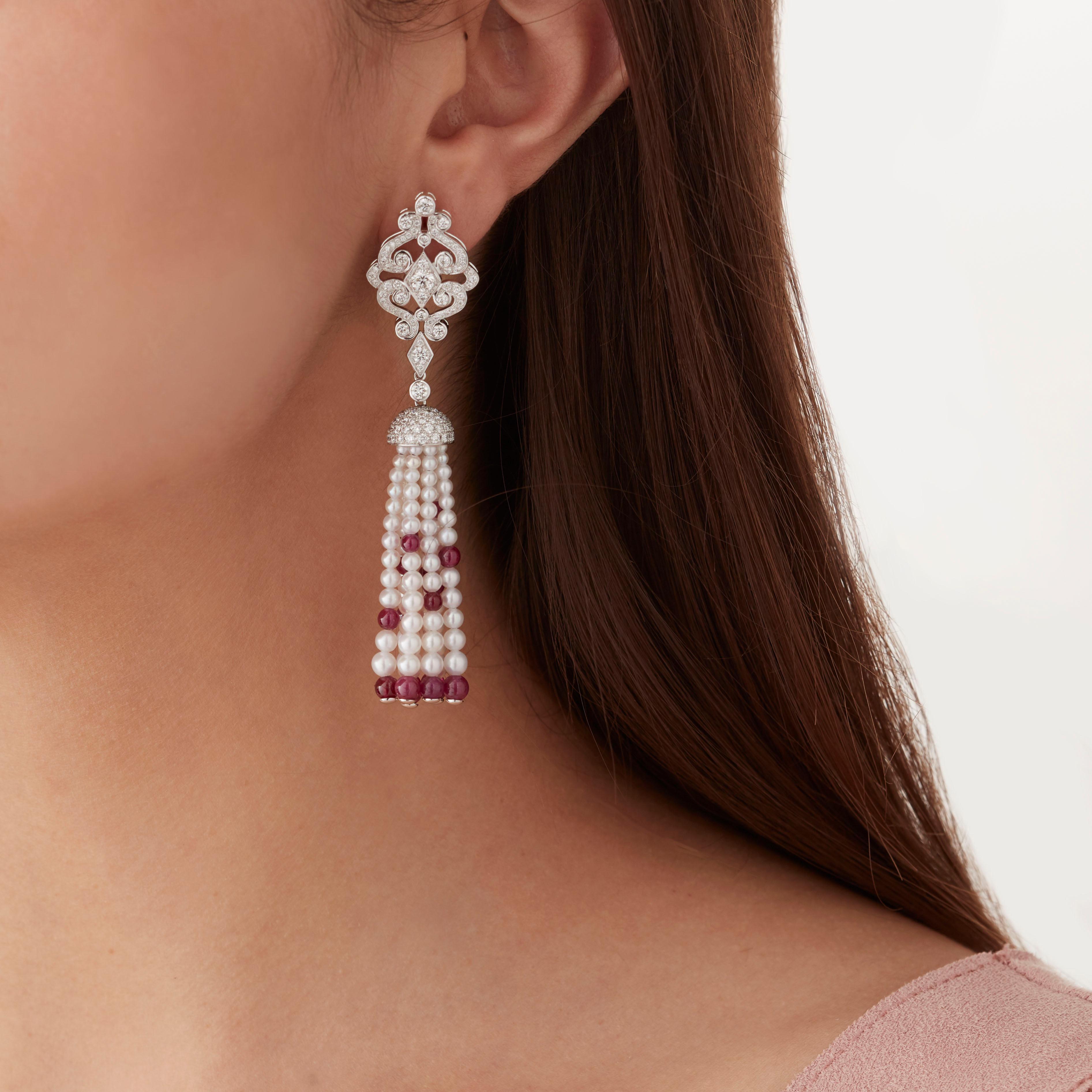 A House of Garrard pair of 18 karat white gold earrings from the Albemarle collection set with round white diamonds, polished ruby beads and white pearls.

268 round white diamonds weighing 3.35cts
Total diamond weight: 3.35cts                      