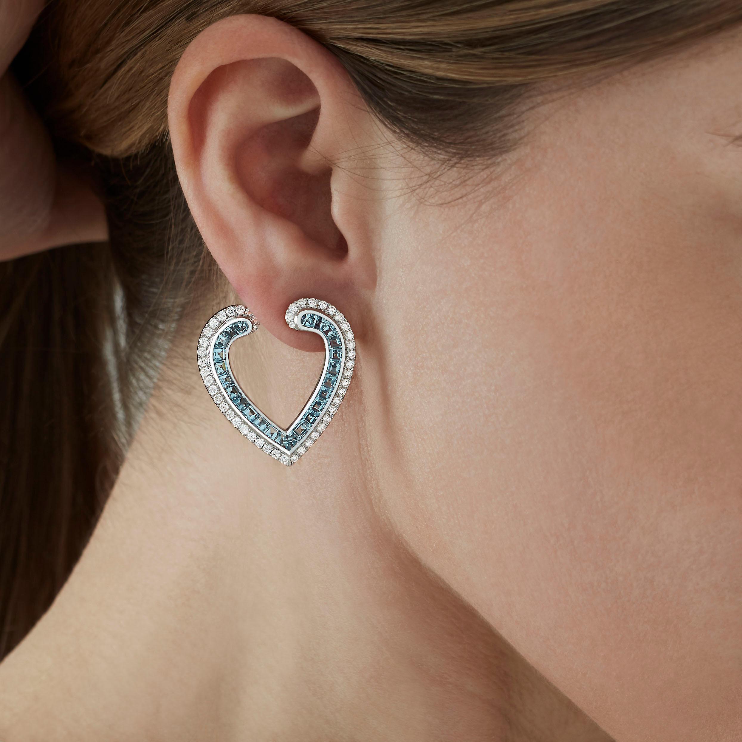 A House of Garrard pair of 18ct white gold earrings from the 'Aloria' collection, set with round white diamonds and calibre cut aquamarines. 

96 round white diamonds weighing: 1.40cts 
48 calibre cut aquamarines weighing: 2.80cts

The House of