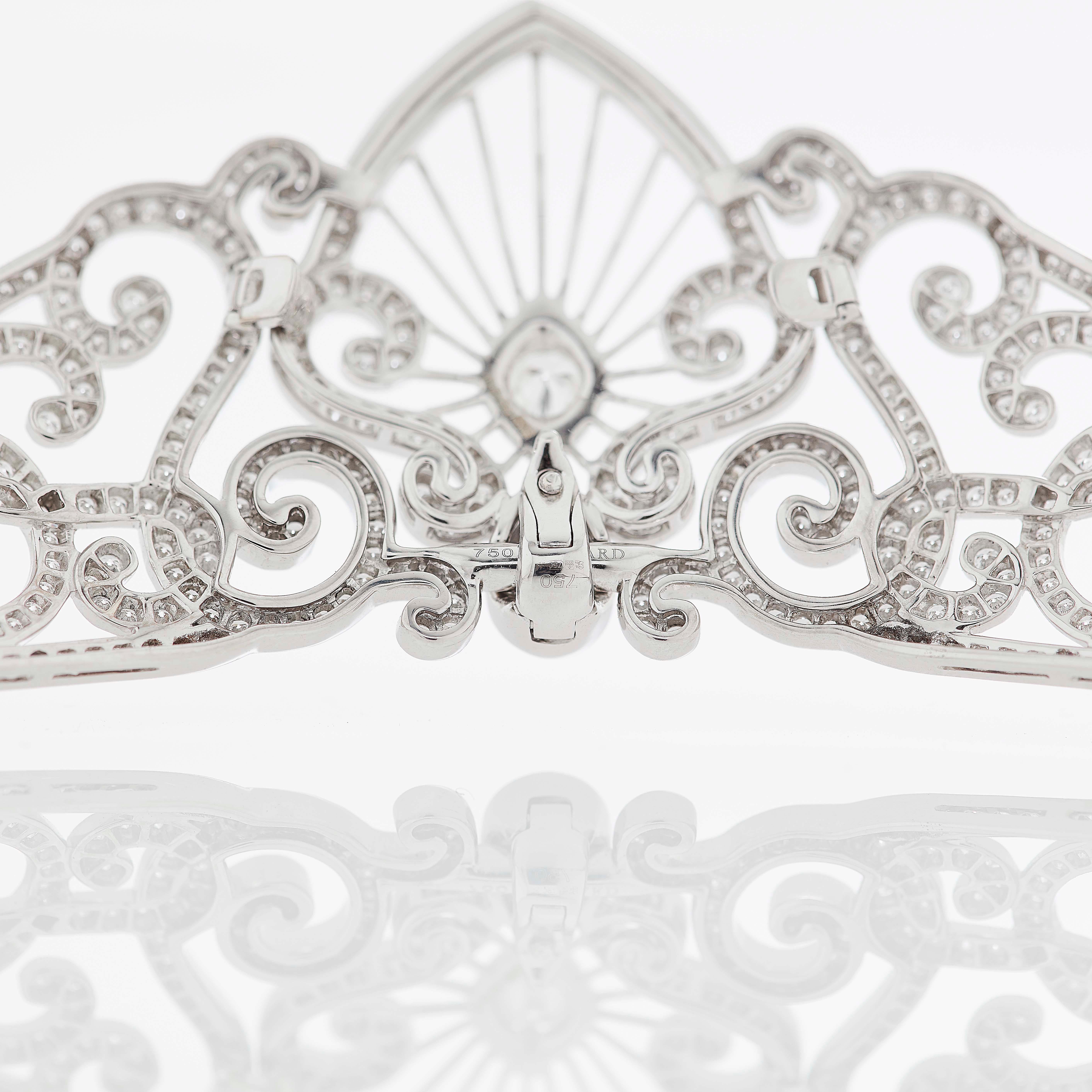A House of Garrard 18ct white gold 'Charlotte' tiara from the 'Princess Tiara' collection, set with round white diamonds. The central motif detaches to become a pendant on a chain. 

 646 round white diamonds weighing: 4.96cts  

The House of