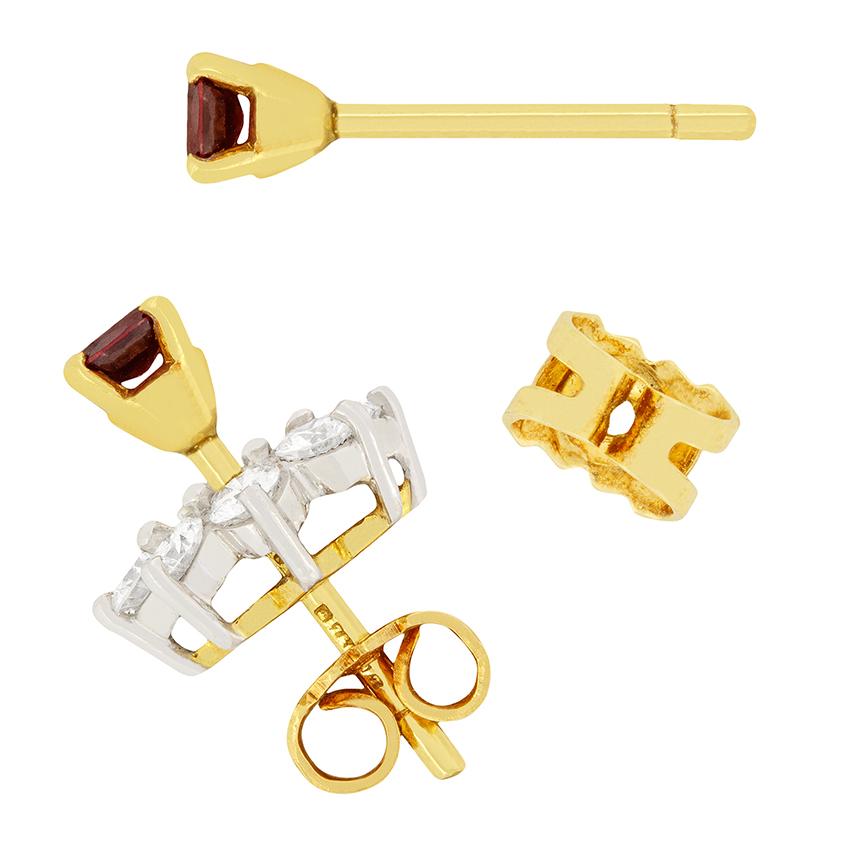 Cleverly designed are these Garrard & Co ruby and diamond stud earrings. The rubies in the centre, weighing 0.30 carat each, can be detached from the diamond halo and be worn on their own for a more subtle look. They have been set into four claw