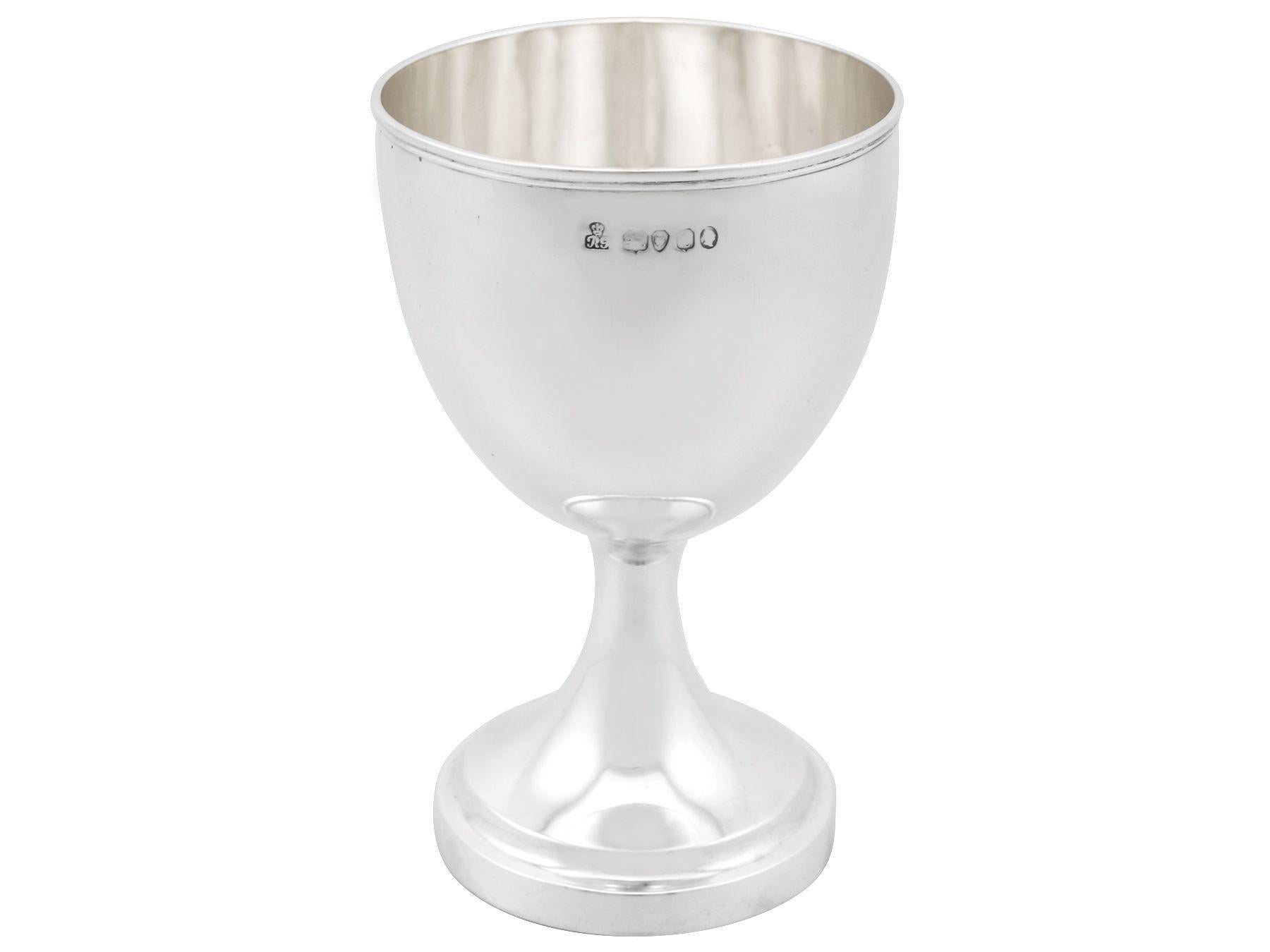 An exceptional, fine and impressive antique William IV English sterling silver goblet made by Robert Garrard II; an addition to our collectable silverware collection.

This exceptional antique William IV sterling silver goblet has a plain bell