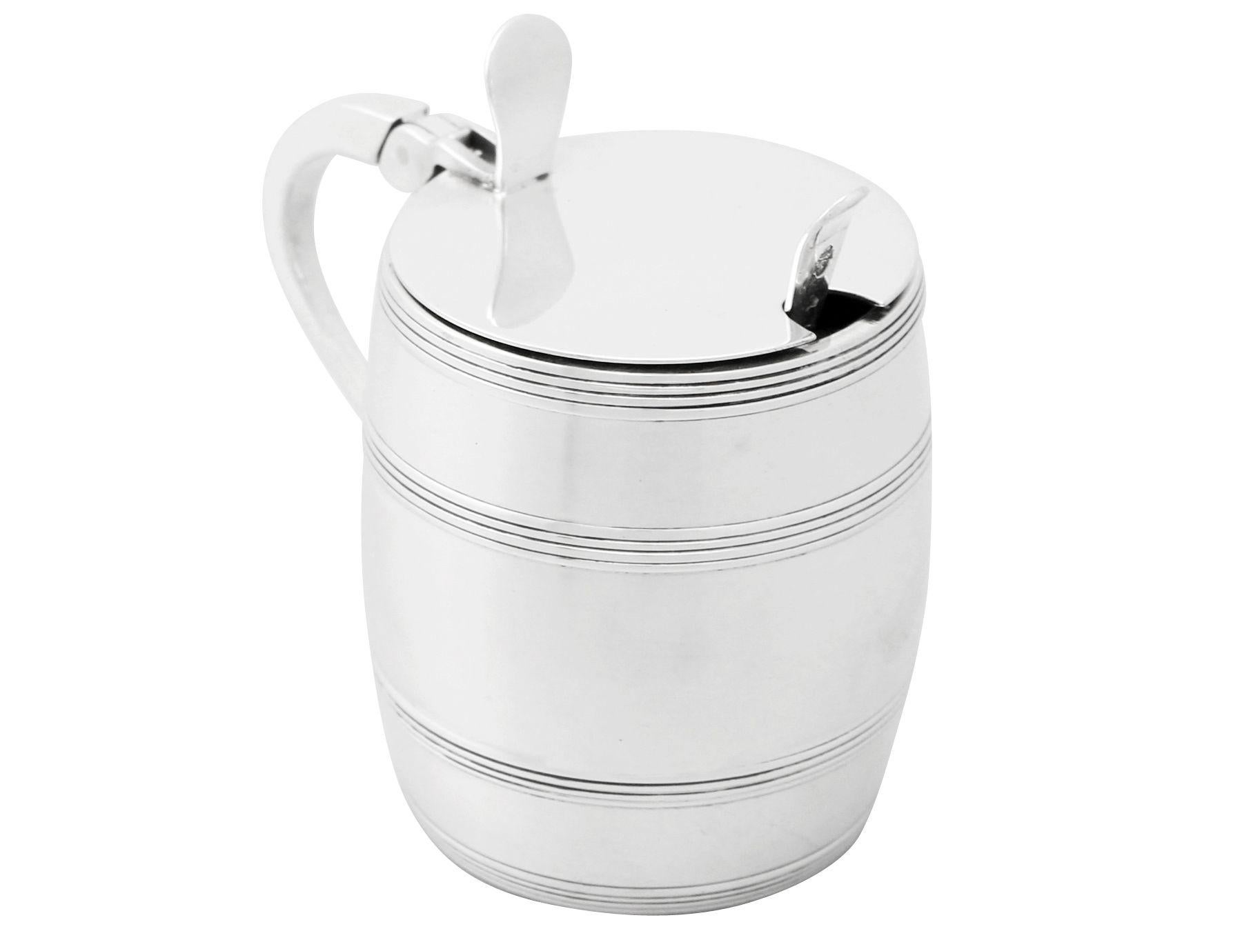 An exceptional, fine and impressive vintage Elizabeth II English sterling silver mustard pot in the form of a barrel; an addition to our silver condiments collection.

This exceptional vintage Elizabeth II sterling silver mustard pot has been