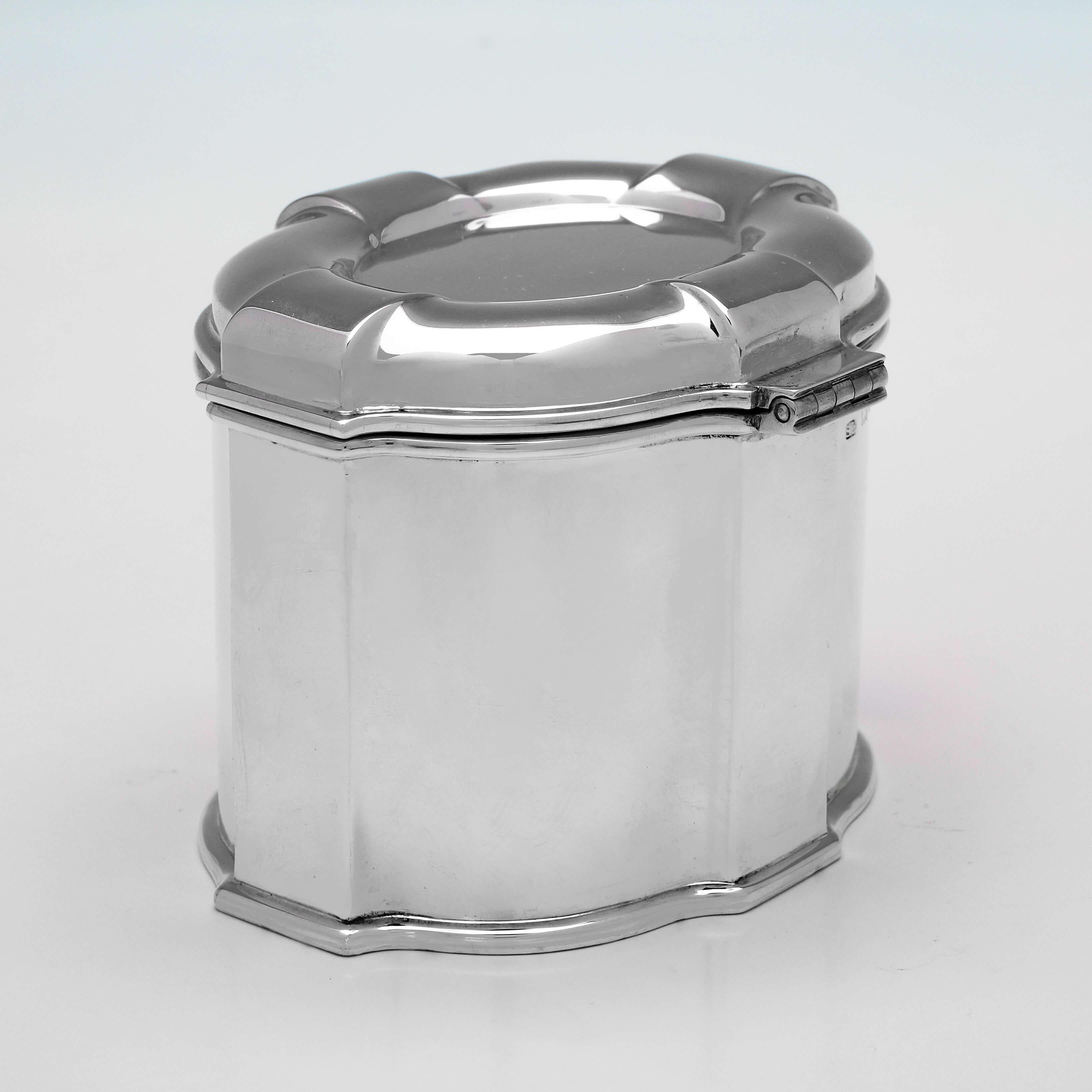 Hallmarked in London in 1926 by Garrard & Co., this handsome, Sterling Silver Tea Caddy, is oval in shape, with panelled detailing. 

The tea caddy measures 3.25