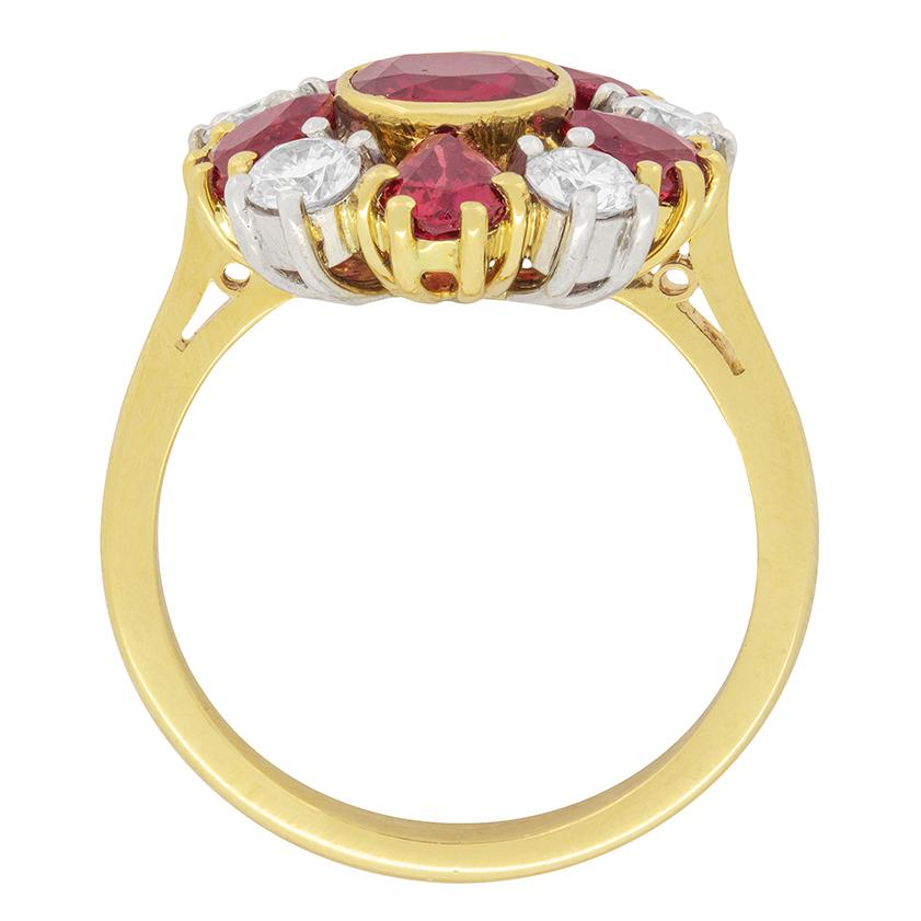 A wonderful cluster of rubies and diamonds form this attractive vintage Garrard & Co ring. There are five pear shaped rubies totalling to 1.28 carat and five round brilliant cut diamonds totalling to 0.61 carat. These diamonds are of top quality,