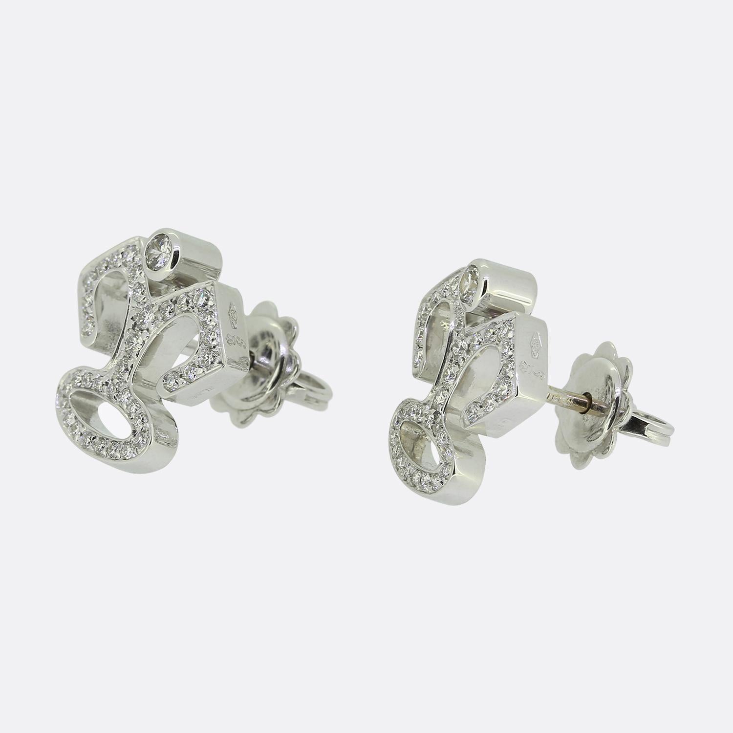 Here we have a striking pair of earrings from Garrard & Co. Crafted from 18ct white gold, these identical pieces feature a unique design with a stylised form, encrusted with bright white round brilliant-cut diamonds. The intricate pattern showcases