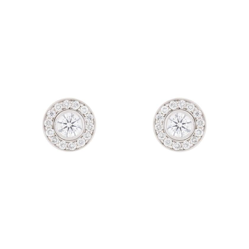 Garrard diamond drop earrings which also turn into stud earrings. Hallmarked in London in 2010, there are round brilliant cut diamonds at the centre of each earring. The halo surrounding is made up of 14 stones. The drop circle consists of 36