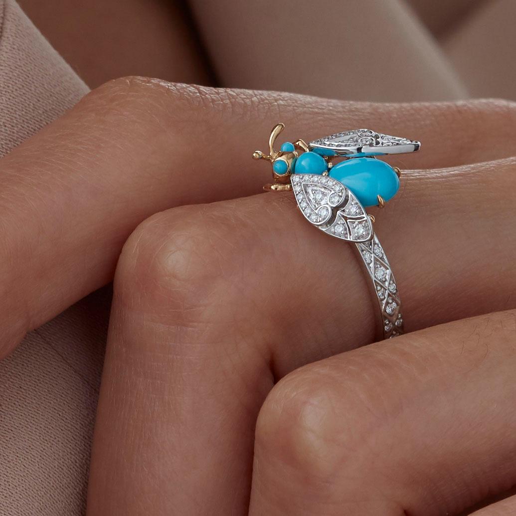 A House of Garrard 18 karat white gold ring from the Enchanted Palace collection set with a turquoise bug motif and round white diamonds.

4 turquoise cabochons weighing 0.85cts
72 round white diamonds weighing 0.29cts
Total diamond weight: