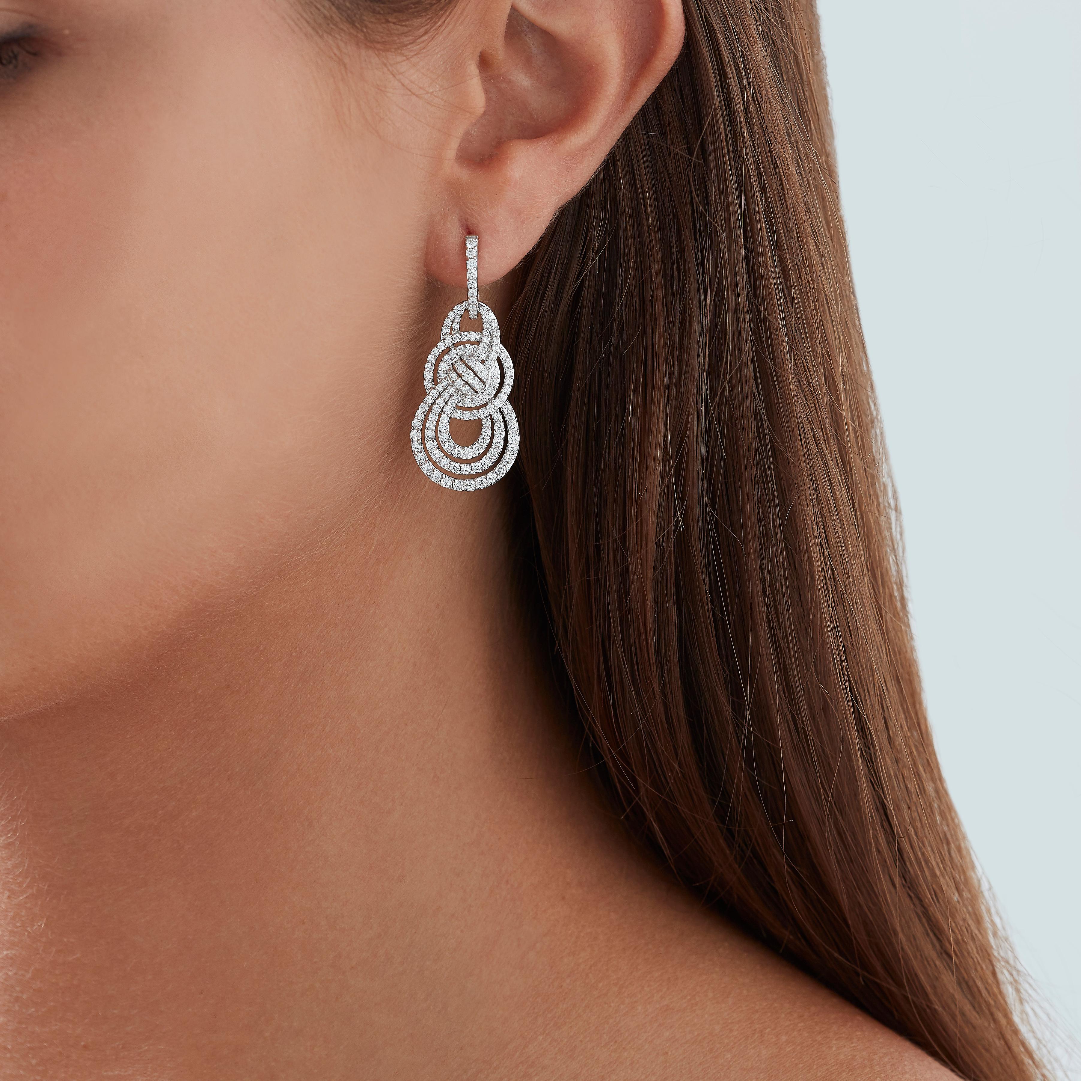  A House of Garrard pair of 18 karat white gold medium double knot earrings from the Entanglement collection set with round white diamonds.

276 round white diamonds weighing 2.09cts
Total diamond weight: 2.09cts                                     
