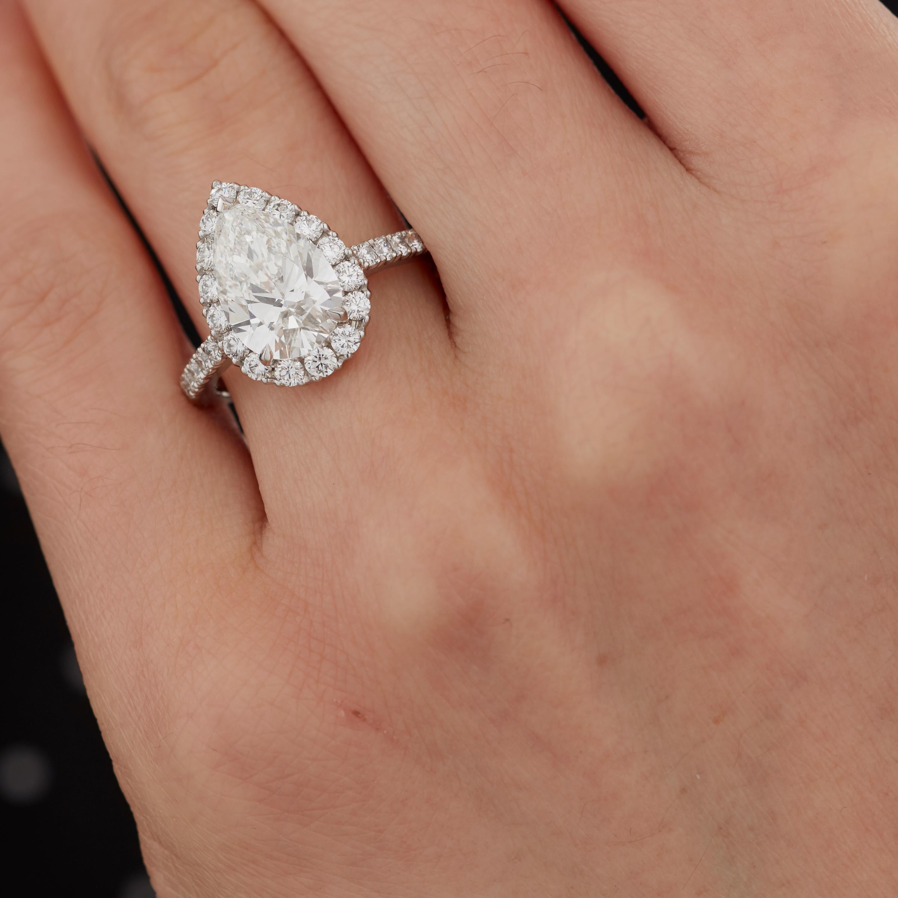 A House of Garrard platinum ring from the 'Garrard Evermore' collection, set with round white diamonds and a central pearshape GIA certified white diamond.

1 pearshape diamond weighing: 3.01cts G VS1 GIA certified
32 round white diamonds weighing