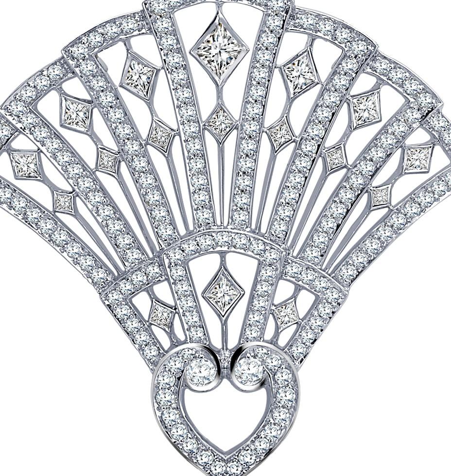 The perfect bridal gift that is beautiful and elegant. 
A House of Garrard 18 karat white gold brooch from the Fanfare collection set with 189 white diamonds weighing 1.92 carats. The brooch measures 40mm by 42mm. 
172 round white diamonds 
17