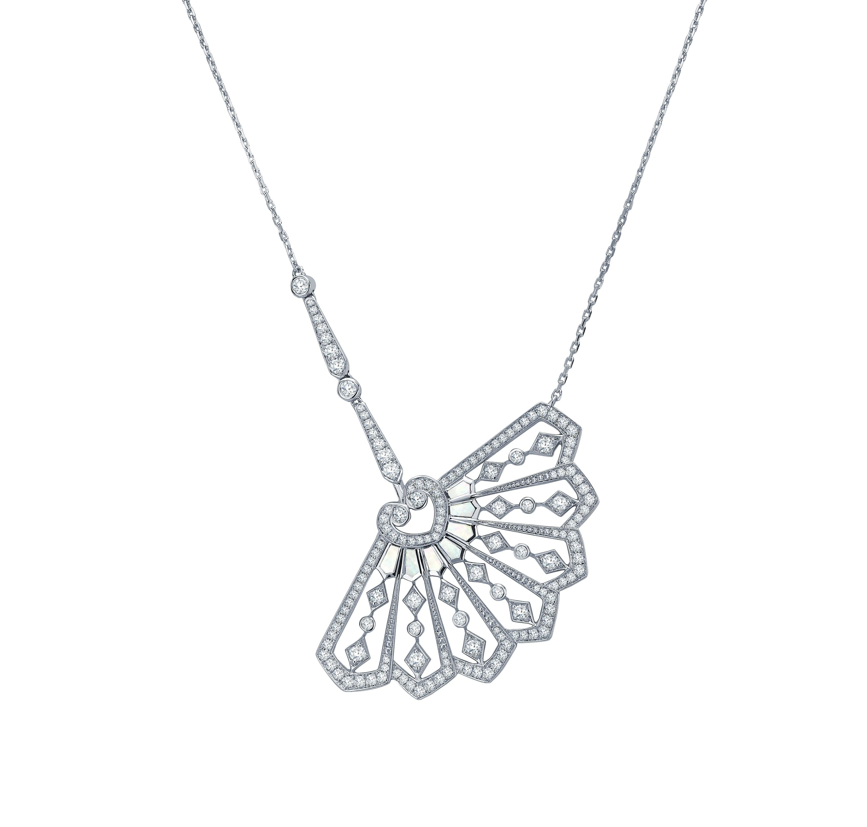 A House of Garrard 18 karat white gold pendant from the Fanfare collection set with 143 round white diamonds weighing 1.29 carats and 7 calibre cut mother of pearl weighing 0.24 carats. The total length of the pendant is 42cm. 
143 round white