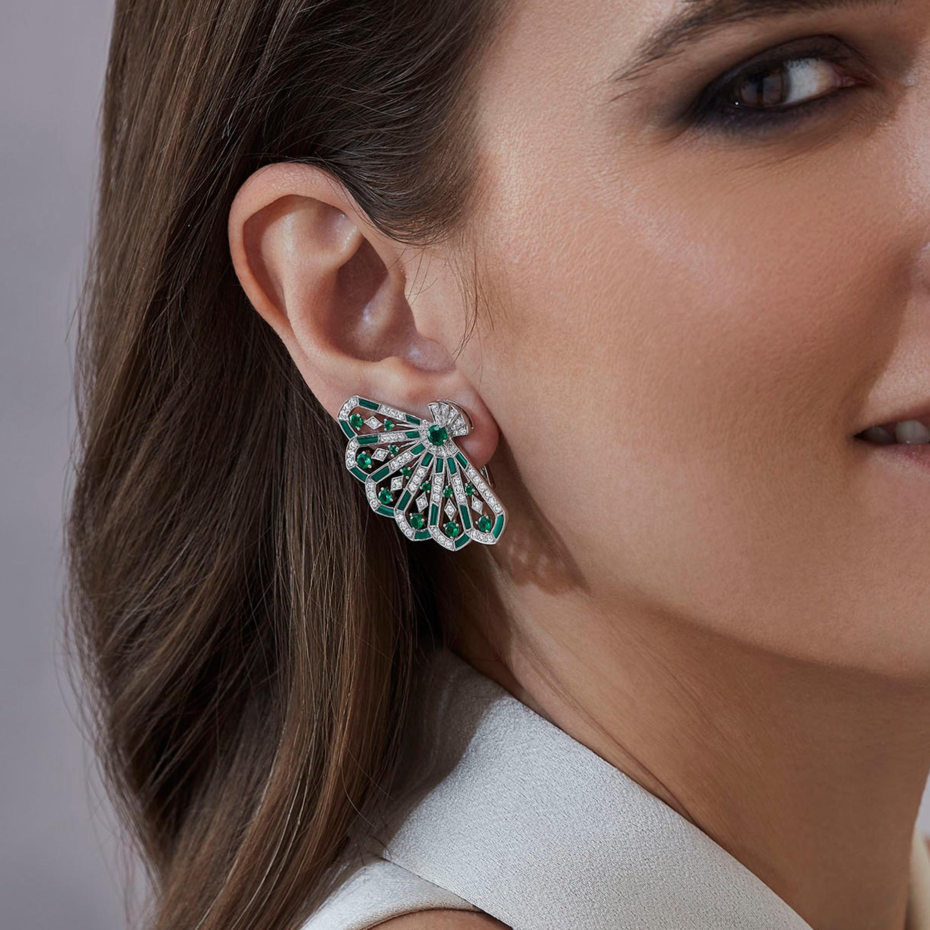 A pair of House of Garrard 18 karat white gold 'Fanfare Symphony' earrings, set with round emeralds, round white diamonds and malachite inlay.

26 round emeralds weighing: 1.42cts
146 round white diamonds weighing: 1.71cts
38 pieces of malachite