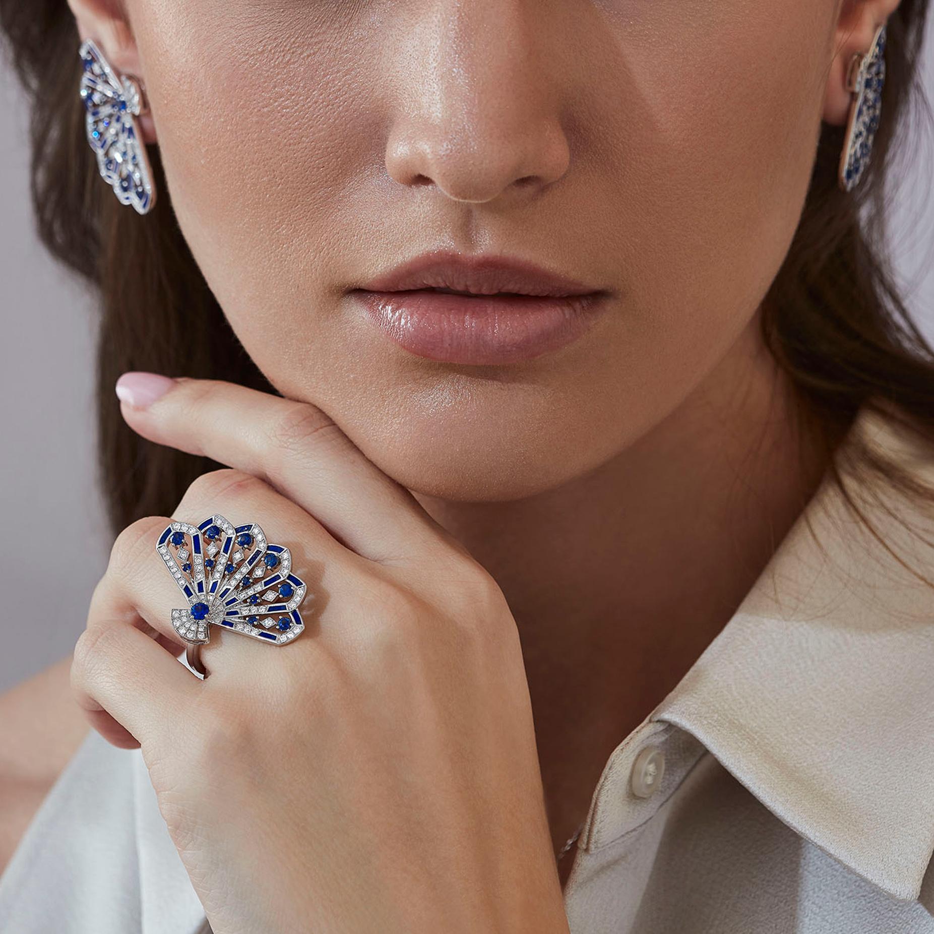 A House of Garrard 18 karat white gold 'Fanfare Symphony' ring, set with round blue sapphires, round white diamonds and lapis lazuli inlay. 

13 round blue sapphires
73 round white diamonds
19 pieces of lapis lazuli inlay
Size 54

Please note rings