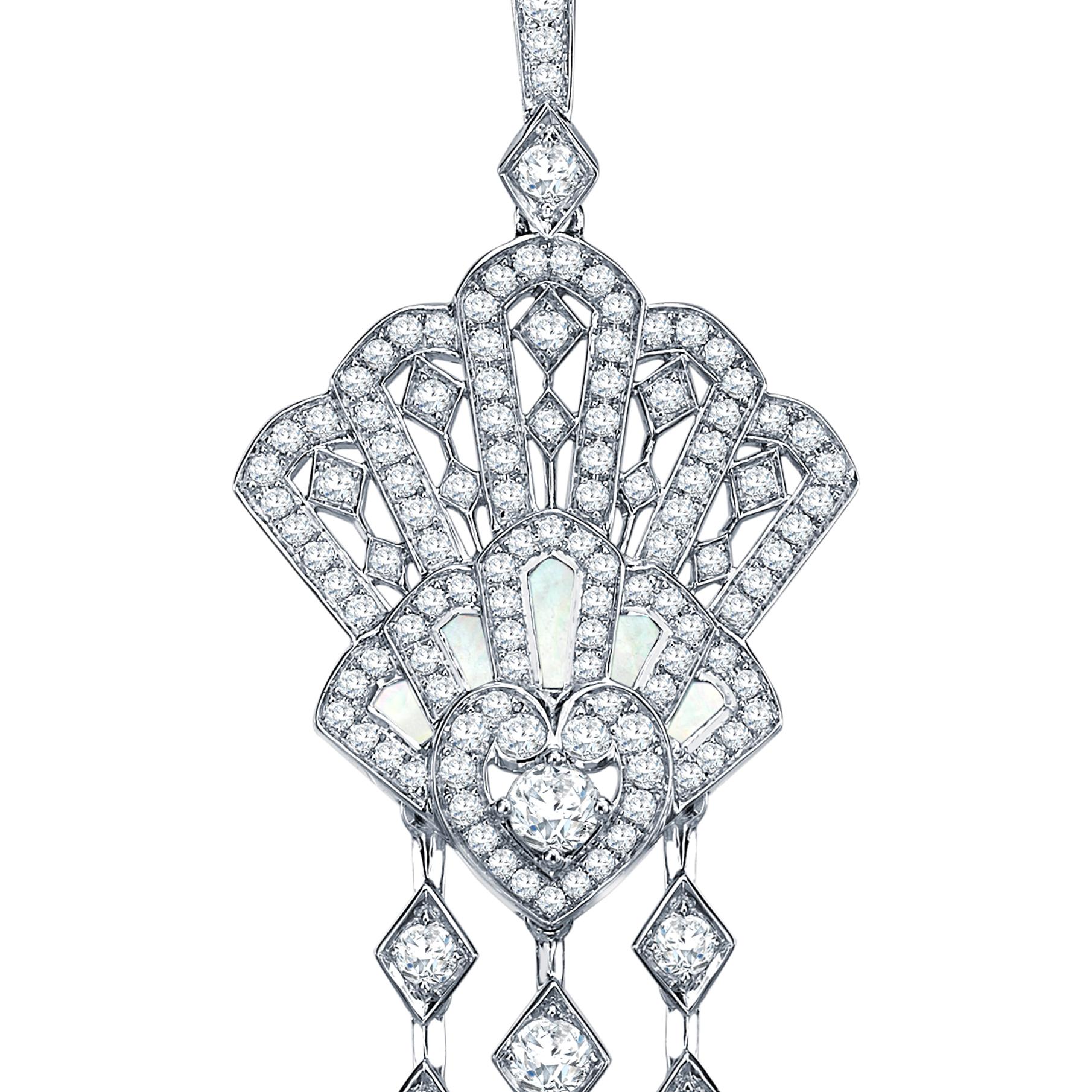 The perfect bridal gift that is beautiful and elegant. 
A pair of 18 karat white gold chandelier earrings from The House of Garrard Fanfare collection set with 346 round white diamonds weighing 5.16 carats and 10 calibre cut mother of pearl weighing