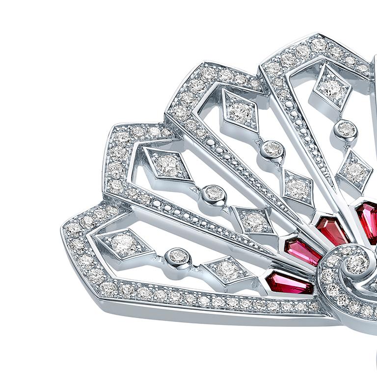 A House of Garrard 18 karat white gold ring from the Fanfare collection set with 131 round white diamonds weighing 1.08 carats and 7 calibre cut rubies weighing 0.50 carats. Size 52 / 6 (Ring can be sized up or down; by 2 sizes)
131 round white