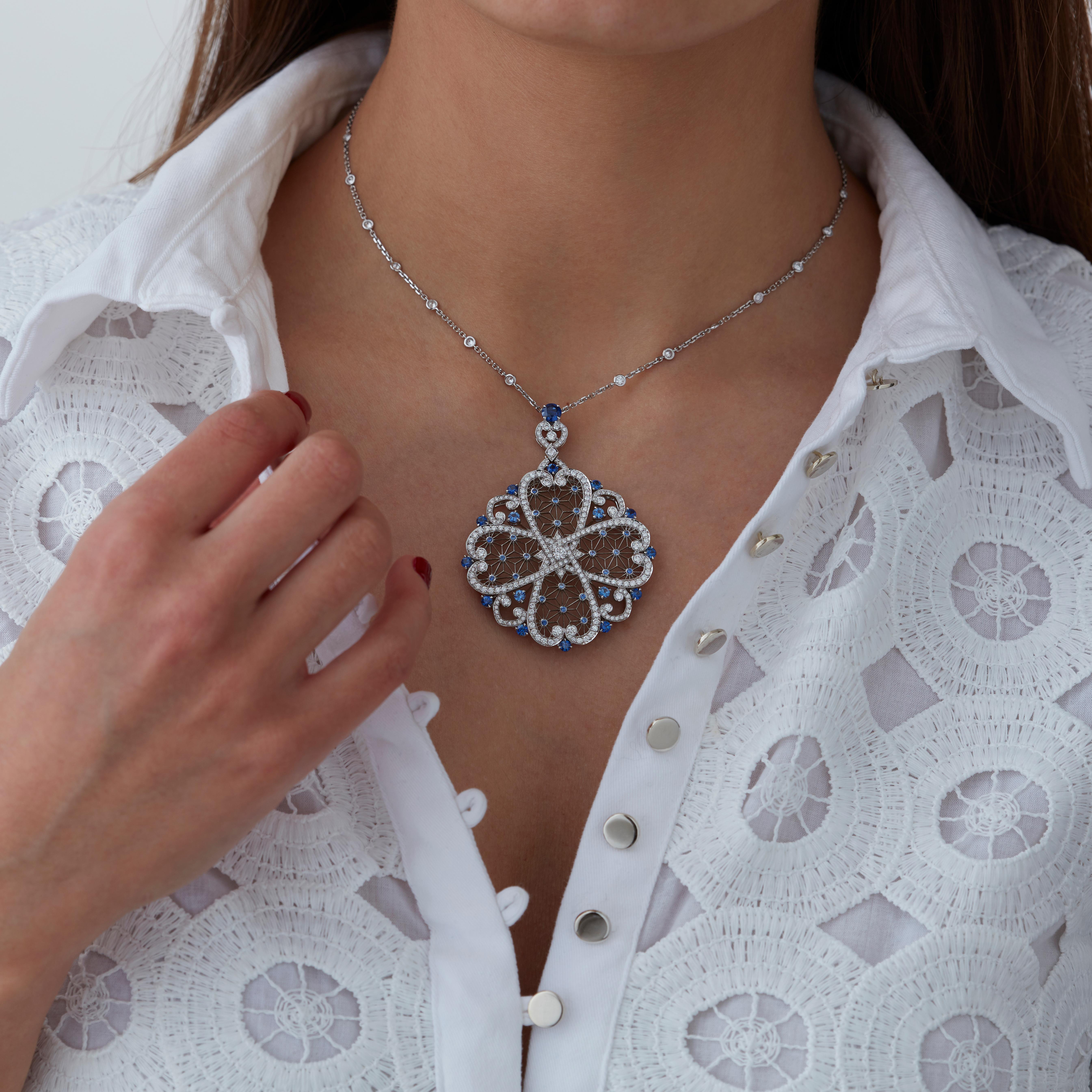 A House of Garrard 18 karat white gold 'Filigree' necklace from the 'Muse' collection, set with round white diamonds and round blue sapphires.                                    
261 round white diamonds weighing: 2.65cts                            
