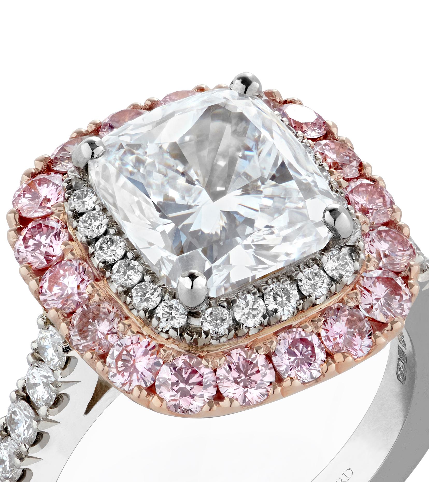 A House of Garrard platinum and 18 karat rose gold engagement ring from the Jewelled Vault collection, set with a central GIA certified cushion cut 3.06 carat D VS1 white diamond, 18 round pink diamonds weighing 0.84 carats and 36 round white