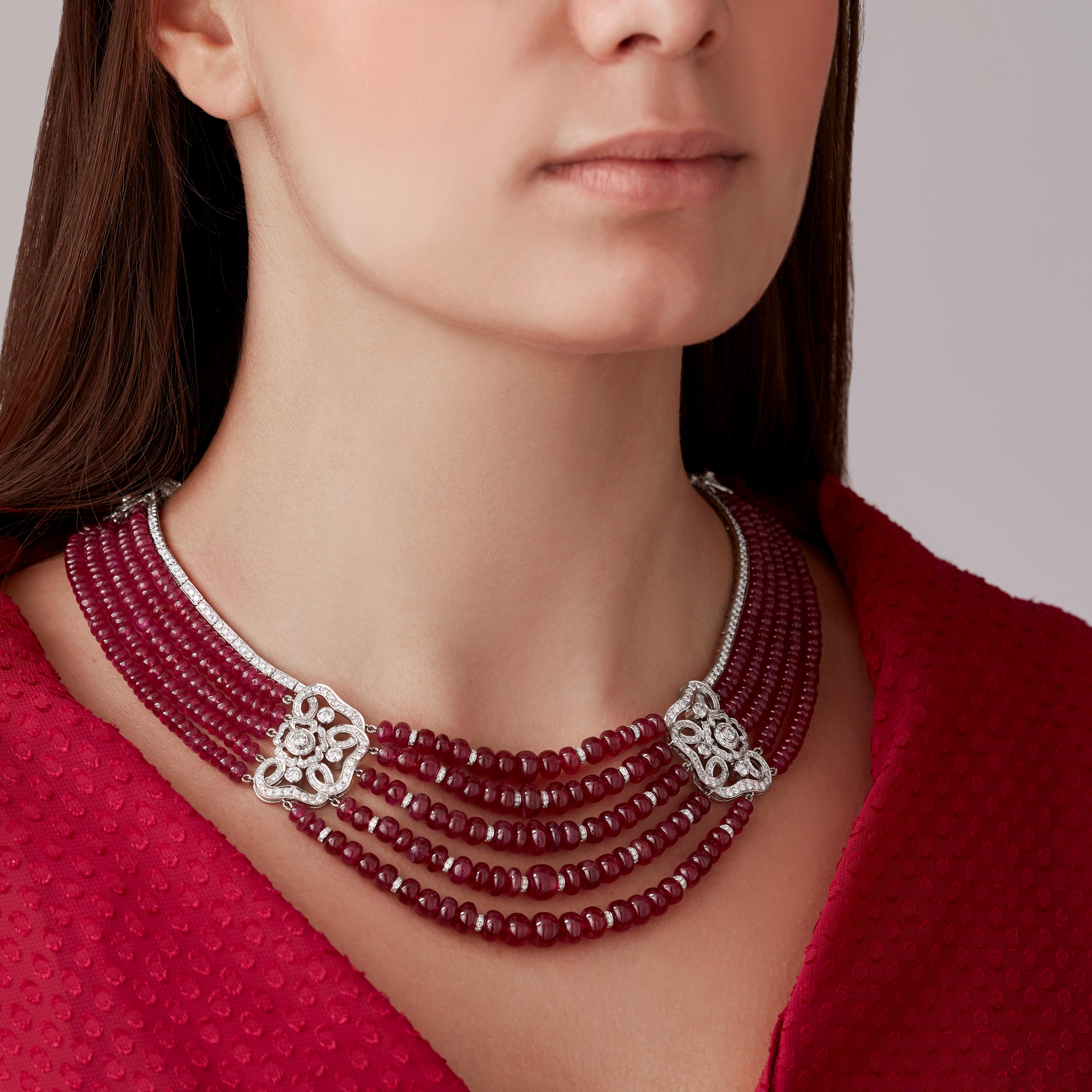 A House of Garrard 18 karat white gold necklace from the 'Red Rose' collection, set with round white diamonds and strung polished ruby button beads. 

917 round white diamonds weighing: 15.79cts
552 ruby button beads weighing: 500cts 

The House of