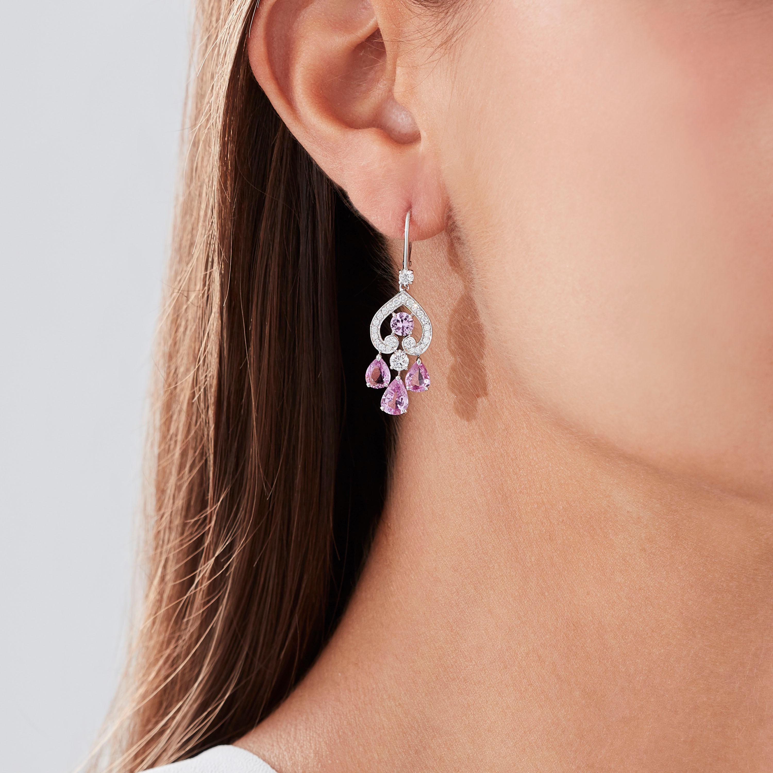 A House of Garrard pair of 18 karat white gold drop earrings from the 'Regal Cascade' collection, set with round white diamonds and round and pearshape pink sapphires.

50 round white diamonds weighing: 0.88cts
8 pink sapphires weighing: