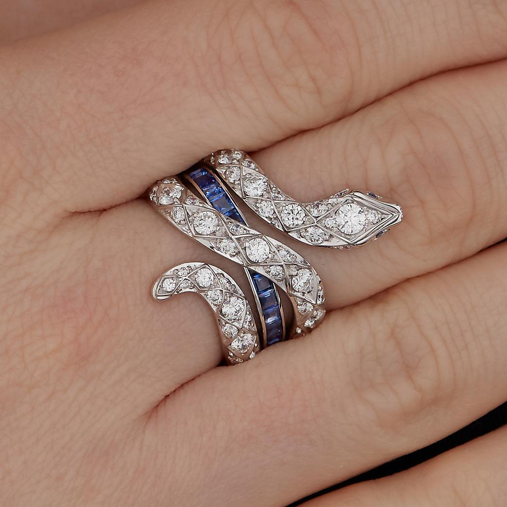 A House of Garrard 18 karat white gold 'Signature Serpent' ring from the 'Muse' collection, set with round white diamonds and round and calibre-cut blue sapphires. 

Total diamond weight: 1.38cts 
Total blue sapphire weight: 1.84cts
Size 52

Please