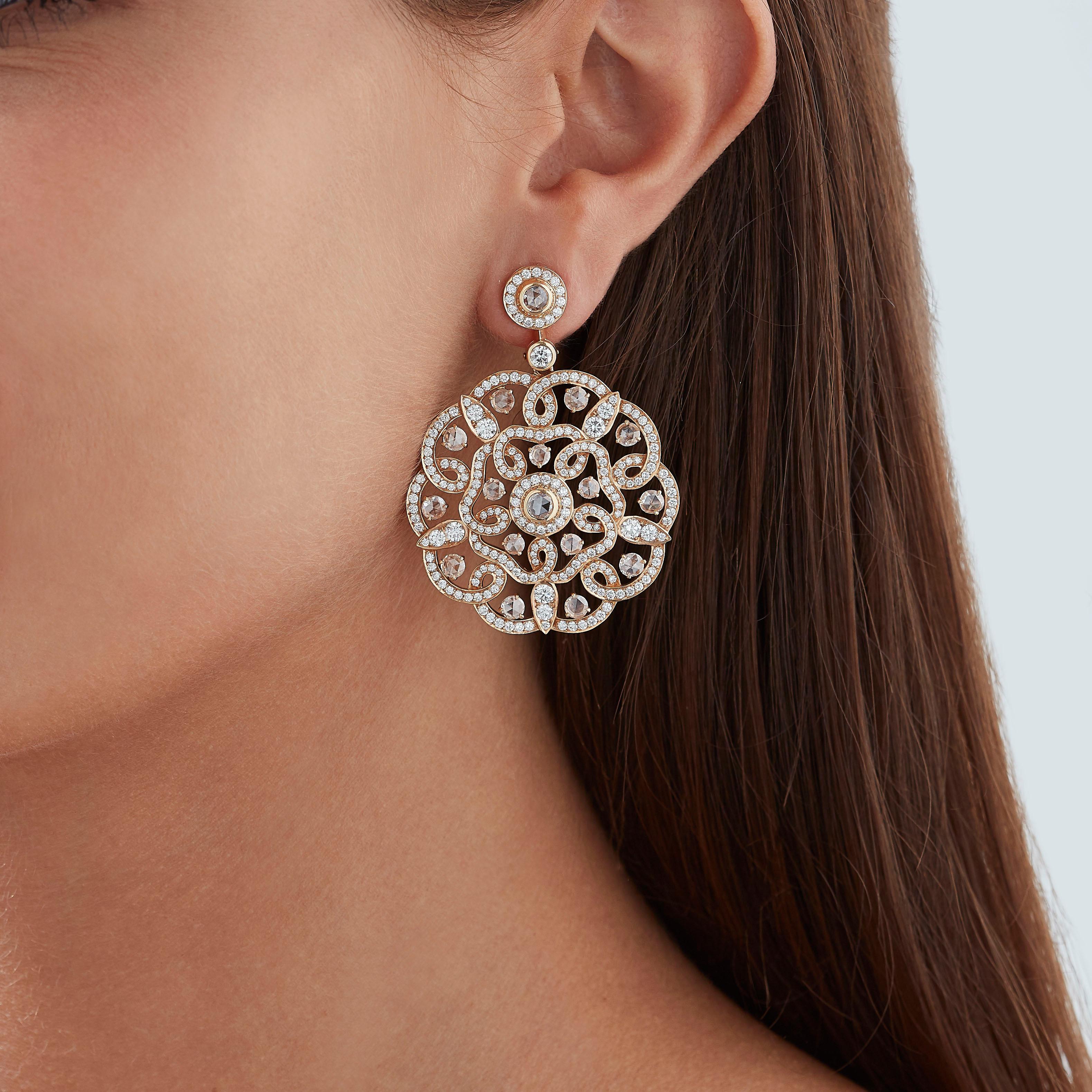 A House of Garrard pair of 18 karat rose gold earrings from the Tudor Rose collection set with rose cut and round white diamonds.                                                      
34 rose cut white diamonds weighing 1.26cts                      