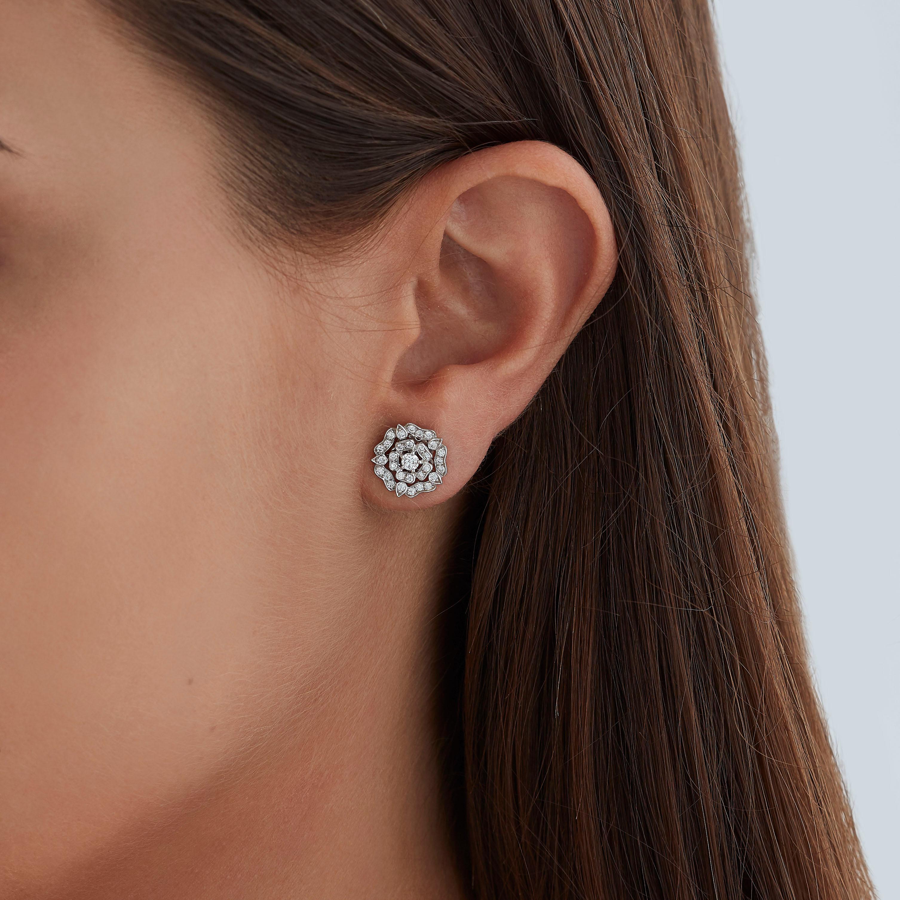 A House of Garrard pair of 18 karat white gold earrings from the 'Tudor Rose' collection, set with round white diamonds. 

62 round white diamonds weighing 0.51cts

Additional Photos and Video available on Request.

The House of Garrard is the