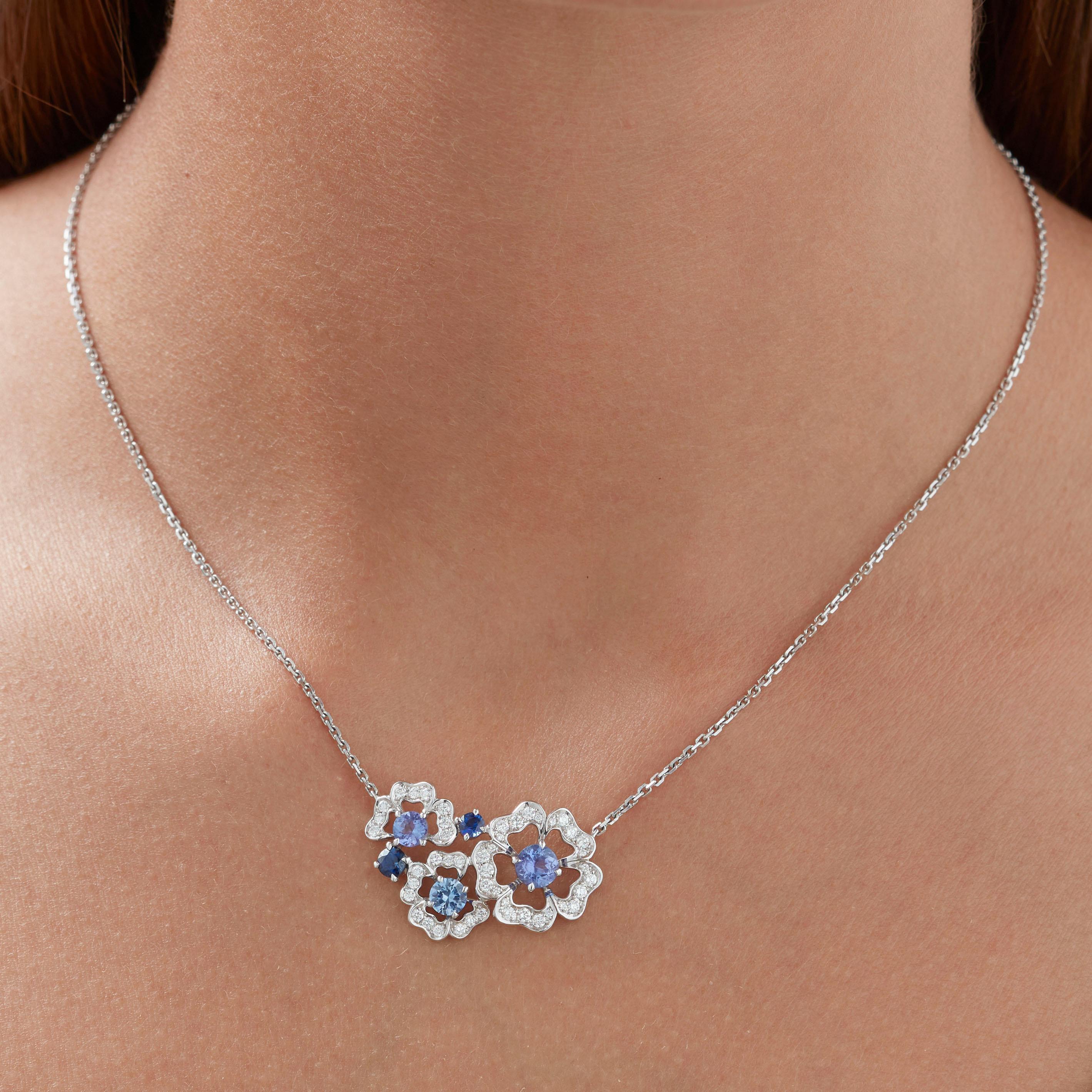 A House of Garrard 18 karat white gold necklace from the Tudor Rose Petal collection set with blue sapphires, tanzanites and round white diamonds.                  
2 round tanzanites weighing 1.25cts                                                 