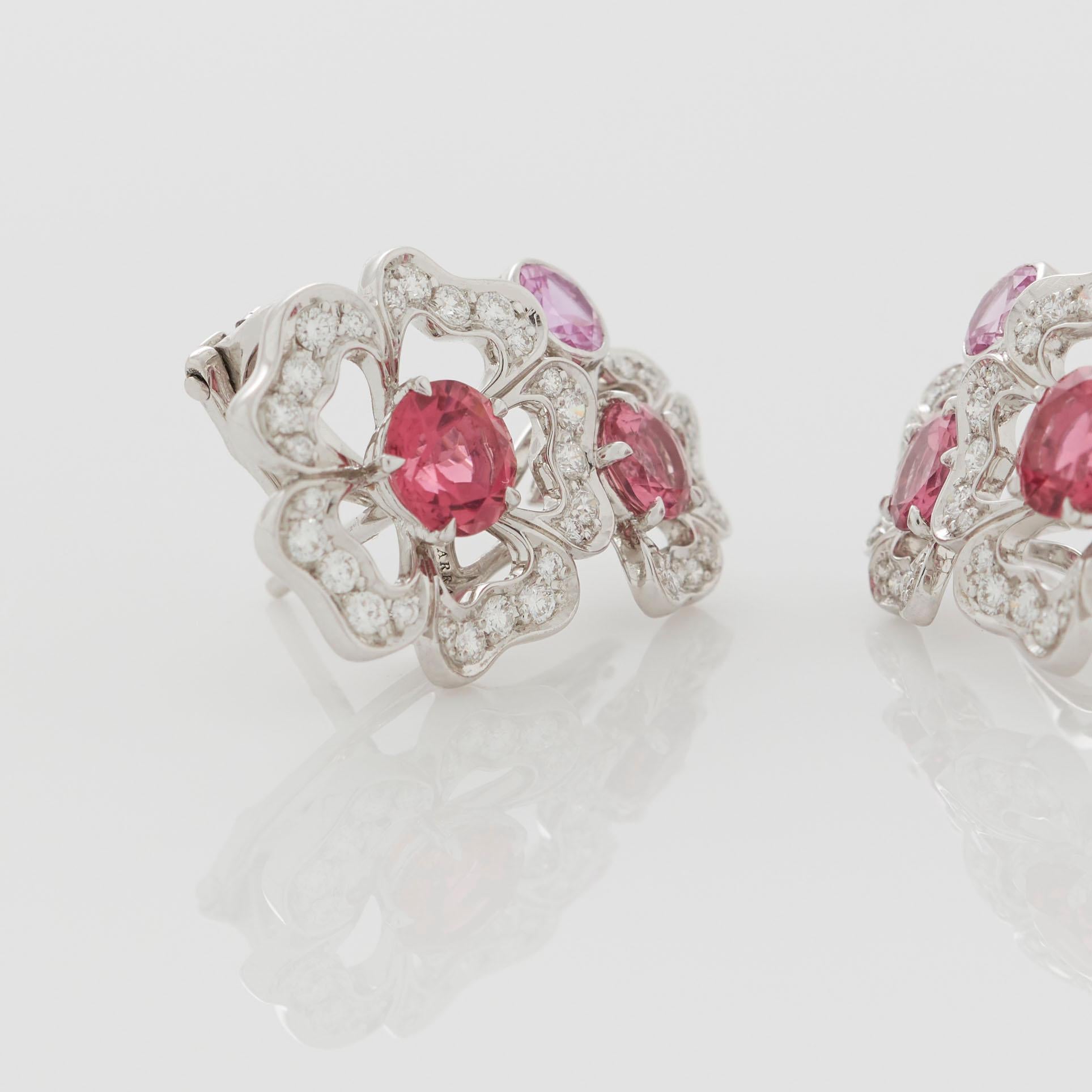 A House of Garrard pair of 18 karat white gold ear climbers from the Tudor Rose Petal collection set with tourmalines, pink sapphires, rubellites and round white diamonds. 

2 round rubellites weighing 1.22cts
2 round pink tourmalines weighing
