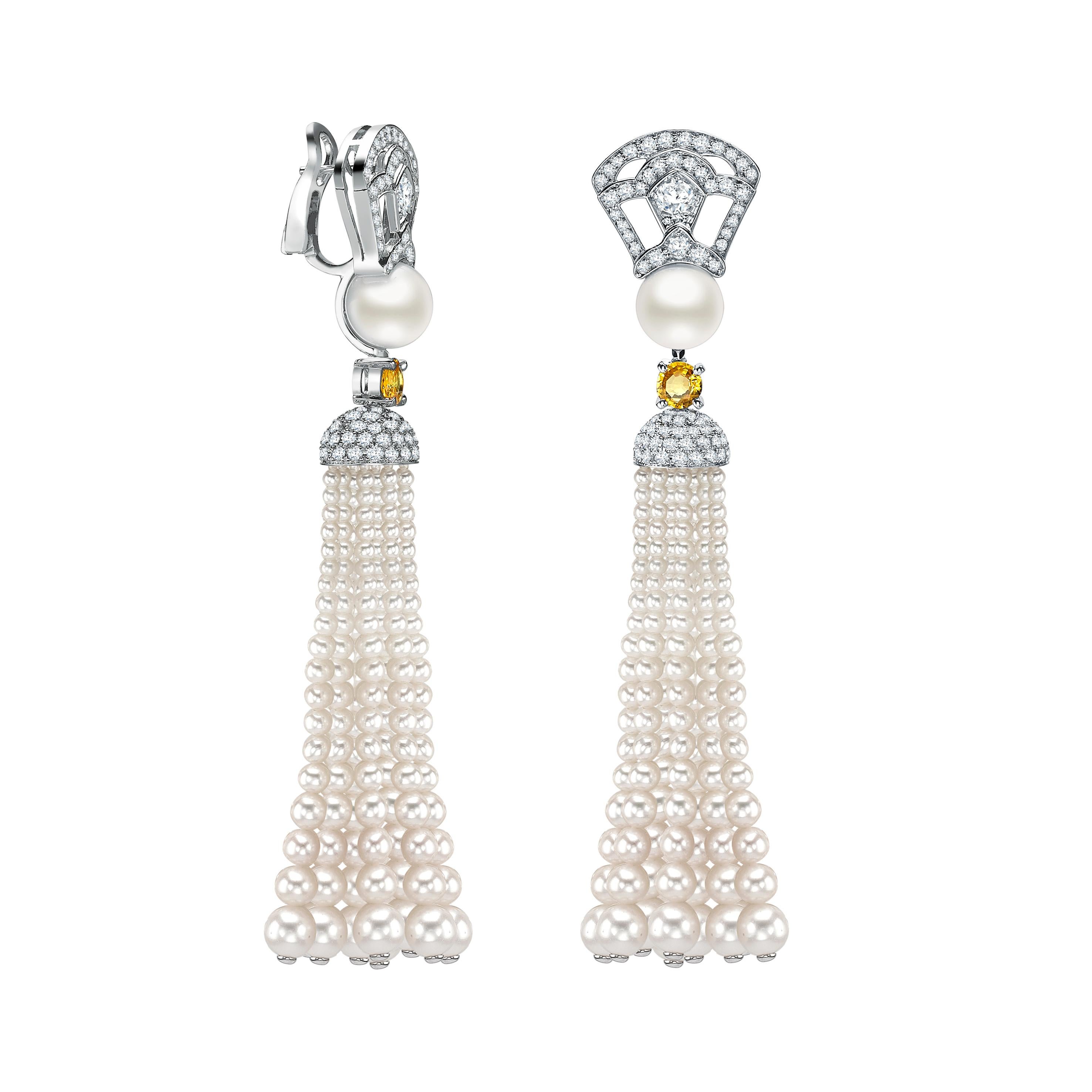 The perfect bridal gift that is beautiful and elegant. 
A pair of 18 karat white gold tassel earrings from the House of Garrard set with two yellow sapphires weighing 0.94 carats, 212 round white diamonds weighing 2.68 carats and 271 freshwater