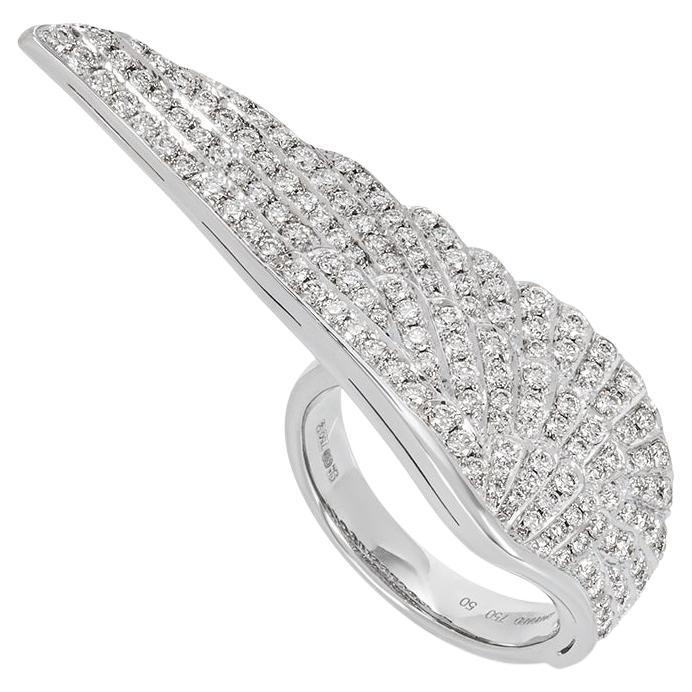 An exquisite 18k white gold diamond ring by Garrard from the Wings Classic collection. The ring exhibits a wing design that spreads over two fingers and is pave set with 147 round brilliant cut diamonds with an approximate total weight of 1.28ct,