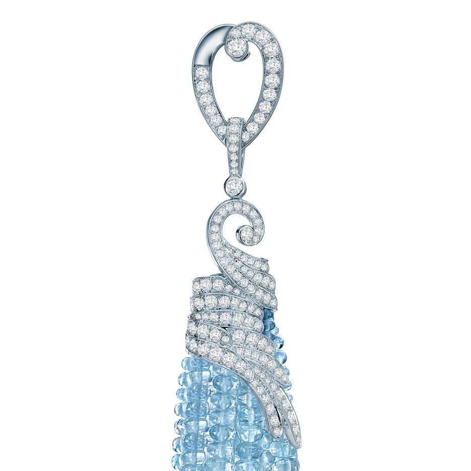A pair of 18 karat white gold and aquamarine tassel drop earrings from The House of Garrard Wings Embrace collection set with 399 polished aquamarine beads weighing 139.09 carats and 246 round white diamonds weighing 2.82 carats. The earring