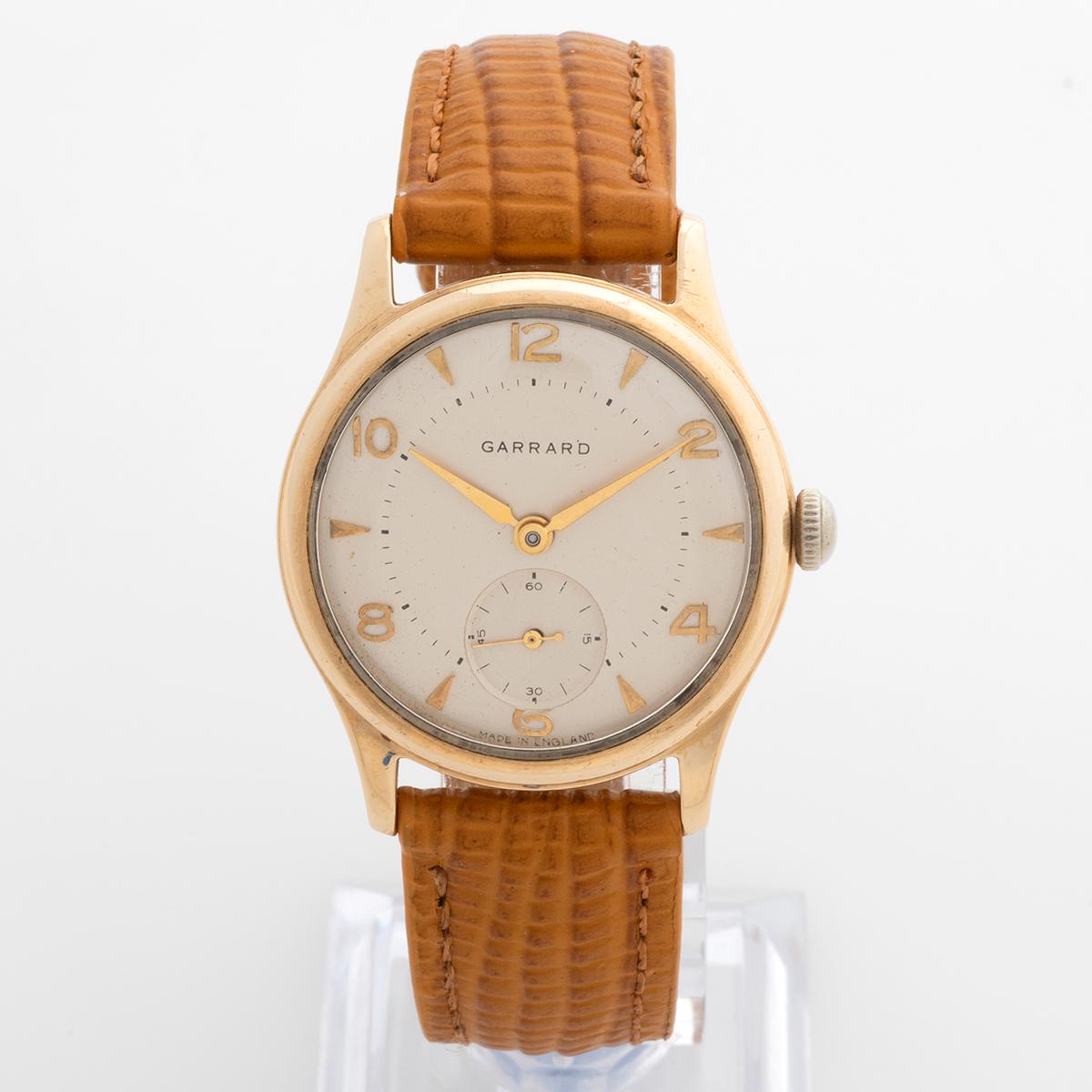 Our vintage and rare Garrard presentation watch features a Dennison Aquatite 9k yellow gold case with screw down case back and 'bowler hat' crown and Smiths 18 jewel movement. A similar case and movement was worn by Sir Edmund Hilary on his Everest