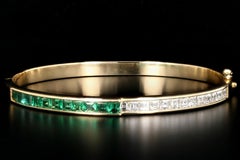 Garrard Yellow Gold Calibre Cut Natural Emerald and Square Cut Diamond Bangle