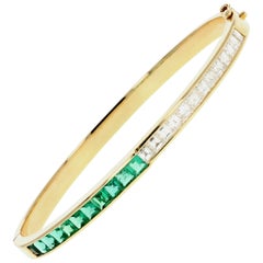 Garrard Yellow Gold Calibre Cut Natural Emerald and Square Cut Diamond Bangle