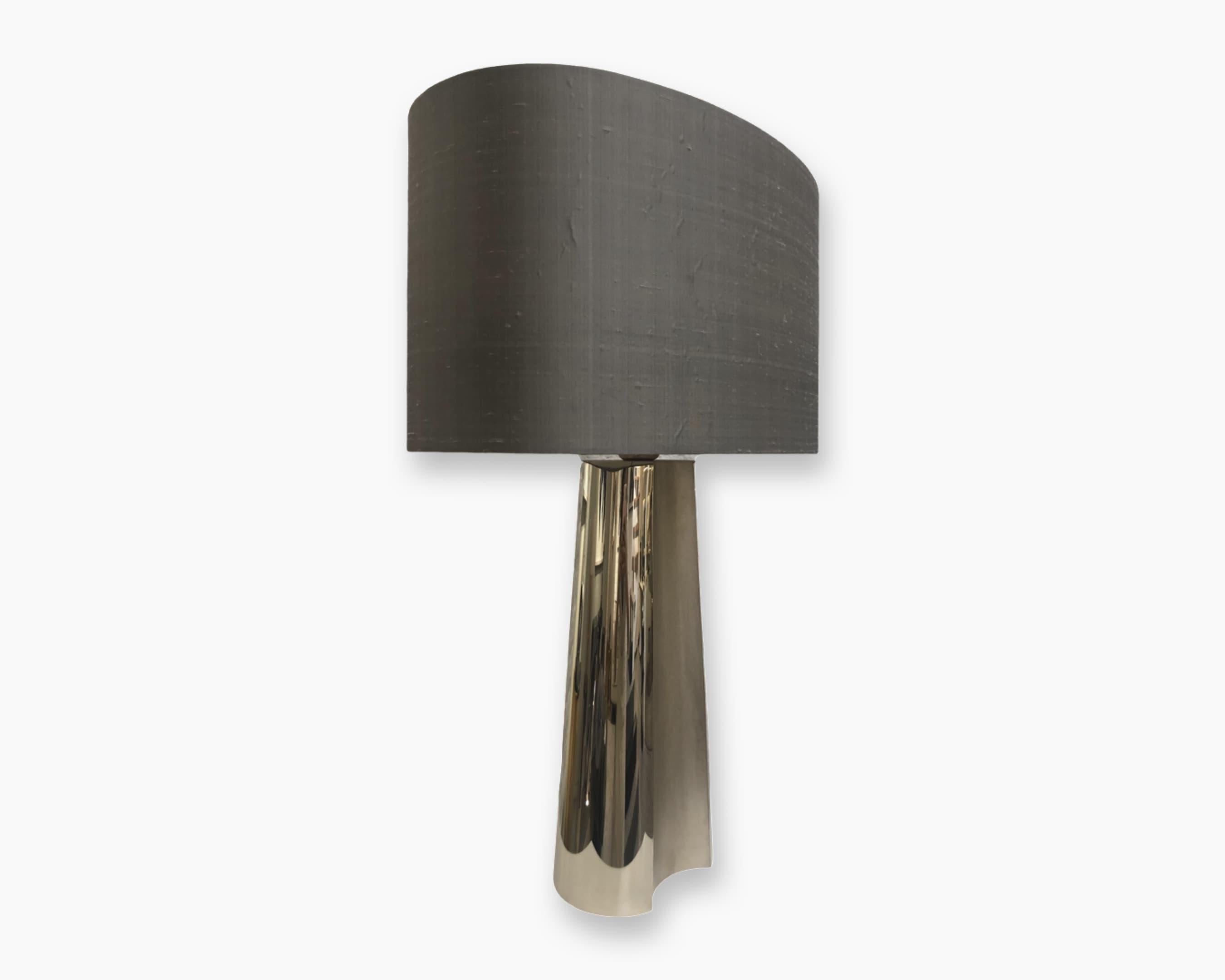 Concave Table Lamp, 2015
The concave table lamp features a subtle geometric design depicted in forged 24 karat champagne gold-plated metal. The curved rounded motif draws its inspiration from the early 20th century Streamline Moderne style of
