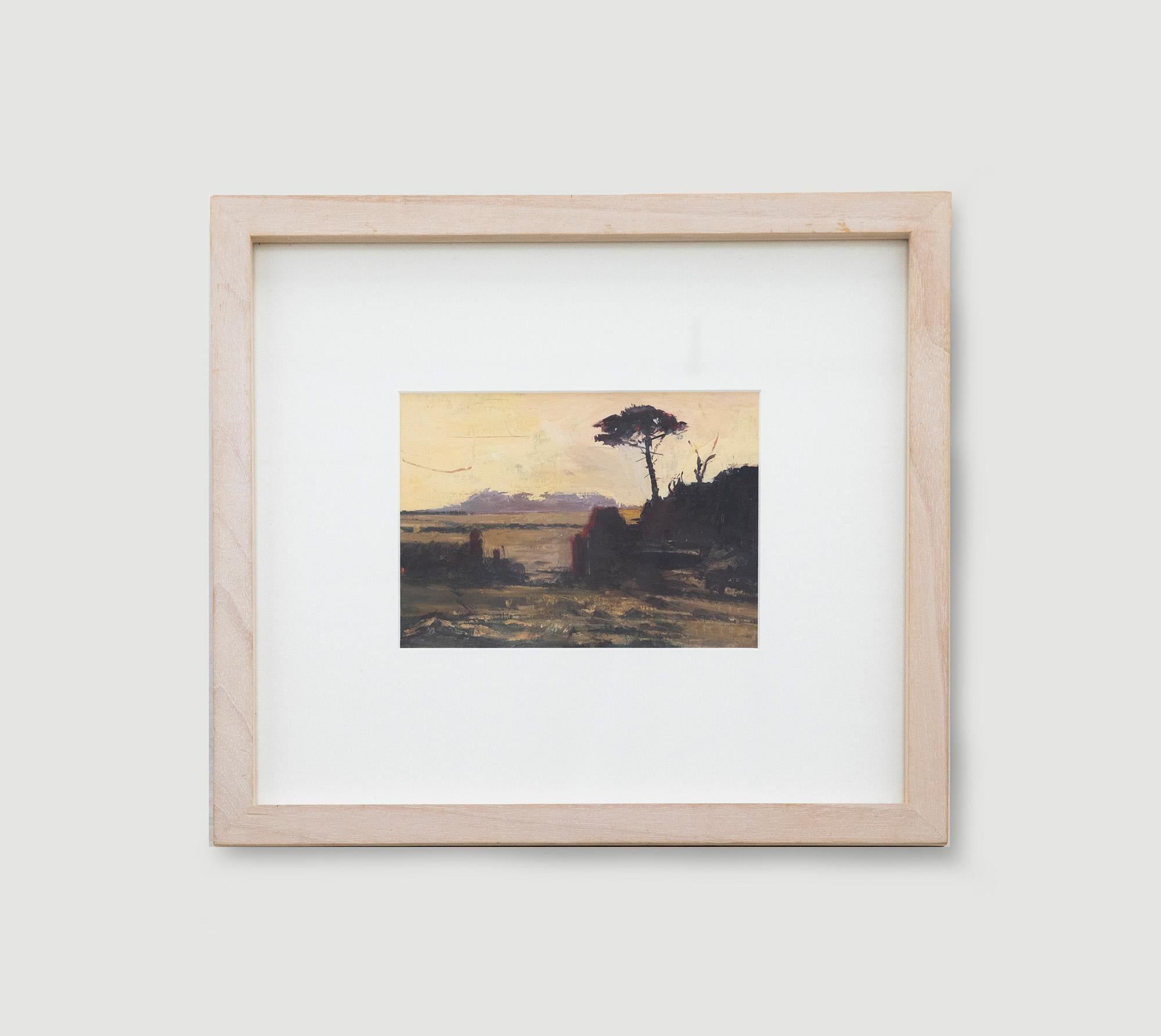An atmospheric oil painting of a country landscape at sunset, with an open gateway leading through to grass fields and woodland. The composition has been signed by the artist to the lower right. Well presented in a contemporary lime-washed frame and