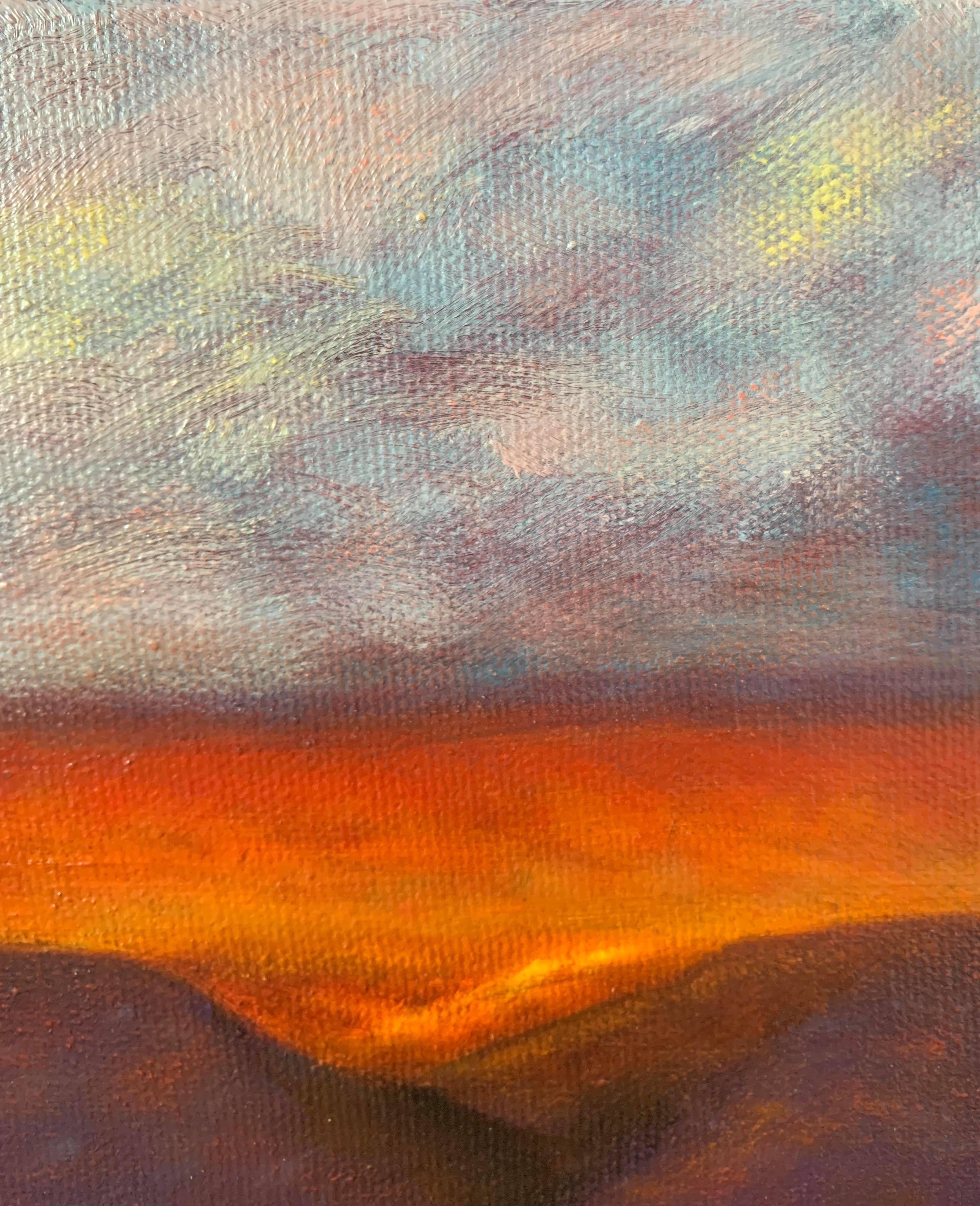 This oil painting shows a desert landscape with glowing red sand, violet mountains, and amethyst skies. In the foreground, rippled by the wind, are deep reddish sands. The small valleys between the mountains glow from the direct light of the sun.