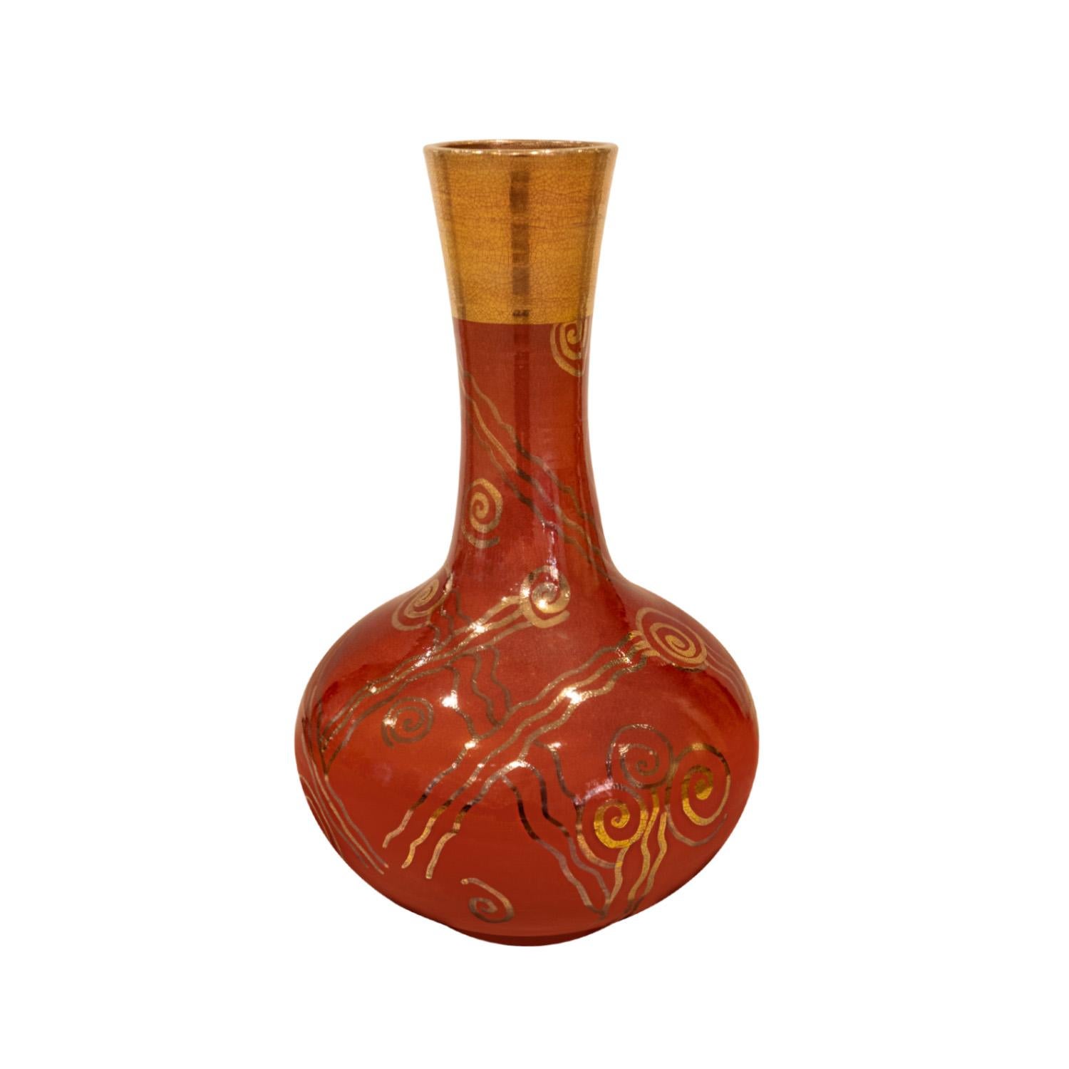 Hand-thrown ceramic vase in Chinese red glaze with applied gold decorative motif by Gary McCloy, American 1970's (signed on the bottom). This vase is impressive and has a lot of visual depth. The combination of Chinese red with gold overlaid is