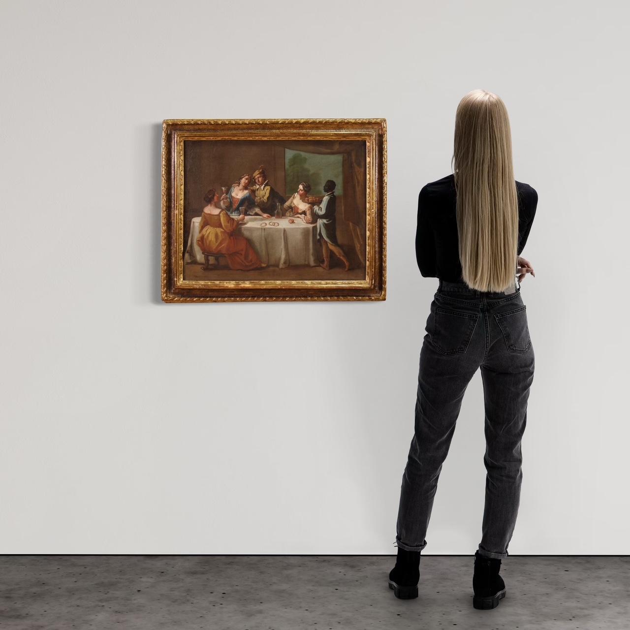 Venetian school of the mid-18th century. Oil painting on canvas depicting a rare interior scene with an elegant banquet, of notable pictorial quality. Painting attributable to the workshop of the Italian painter Gaspare Diziani (1689-1767), lacking