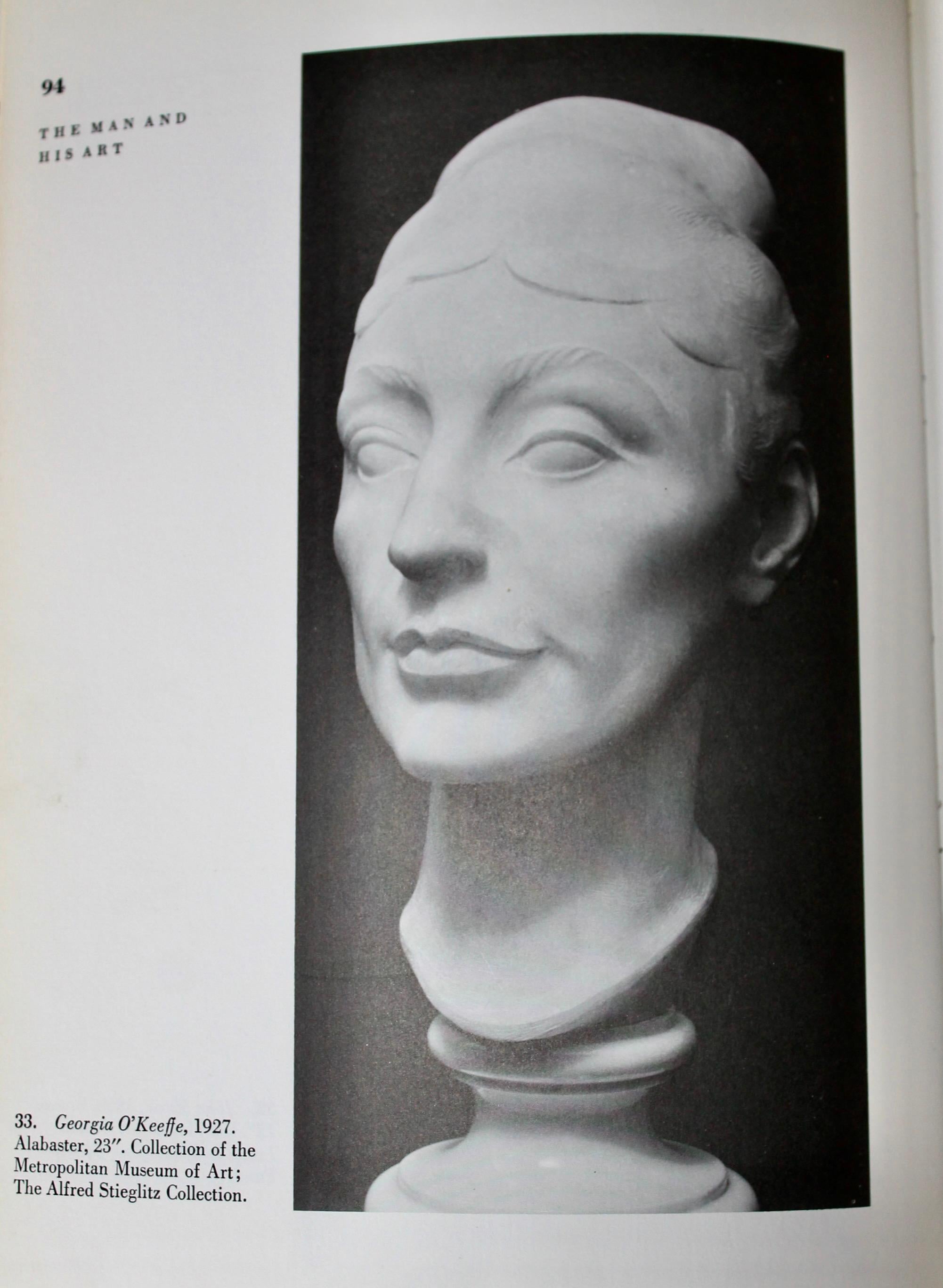 A rare (if mot unique)cast of the clay study for the portrait of Georgia O'Keeffe, commissioned by Alfred Stieglitz in 1926.  The alabaster in the Metropolitan Museum of Art NYC, is a larger,  simplified  and decidedly colder result.  