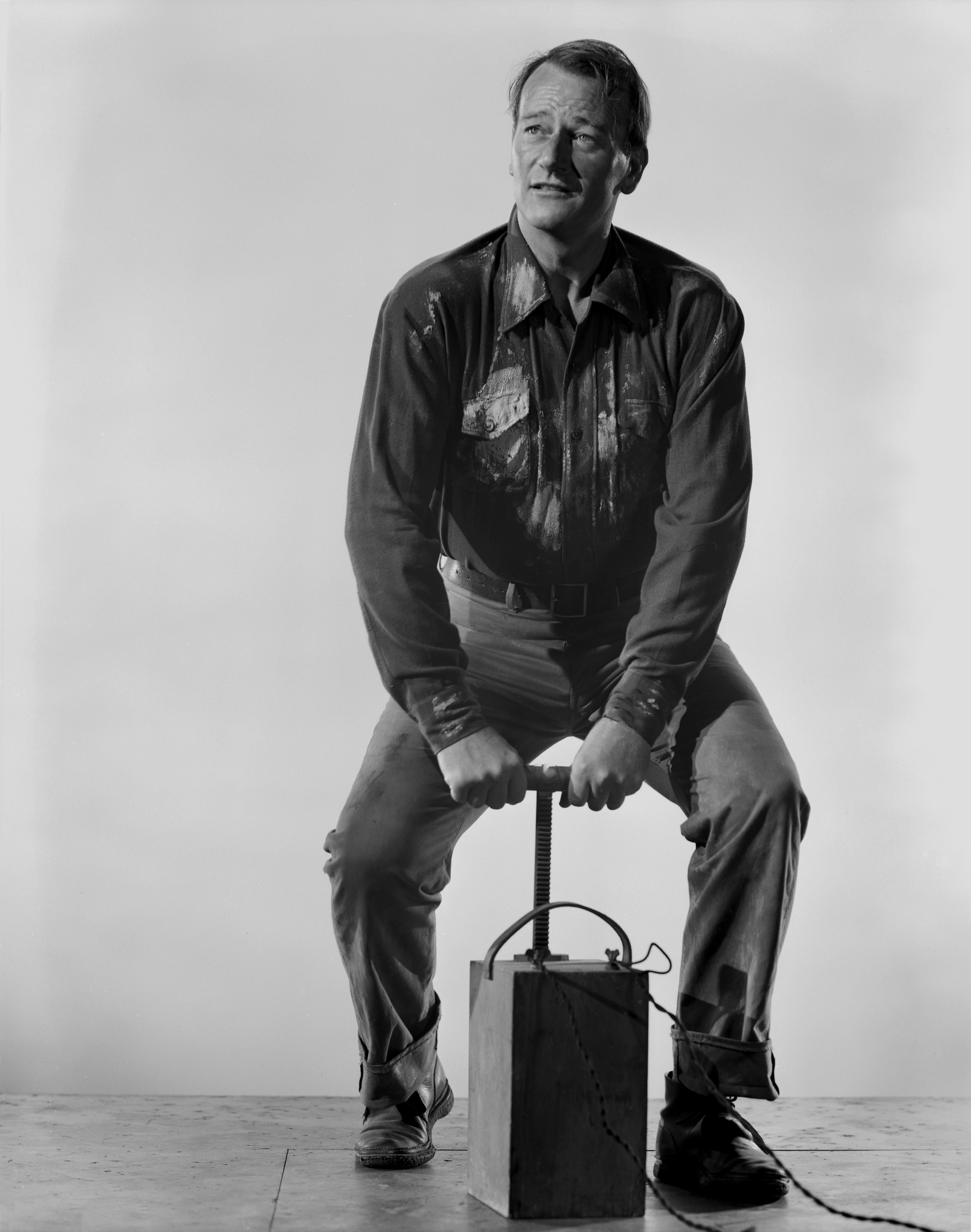 Gaston Longet Black and White Photograph - John Wayne Posed with Detonator Movie Star News Fine Art Print
