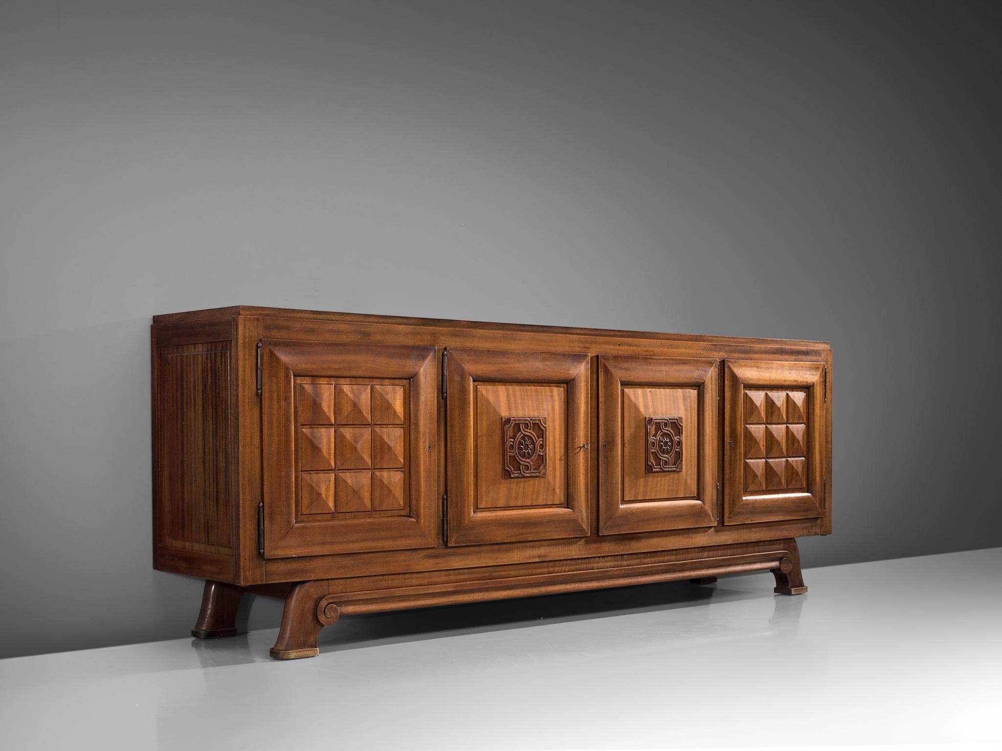 Gaston Poisson, credenza in mahogany, France, 1930s.

Sturdy credenza in with graphical door panels and parquet top. This four-door sideboard is equipped with several shelves and drawers which provide plenty of storage space. The shelves are